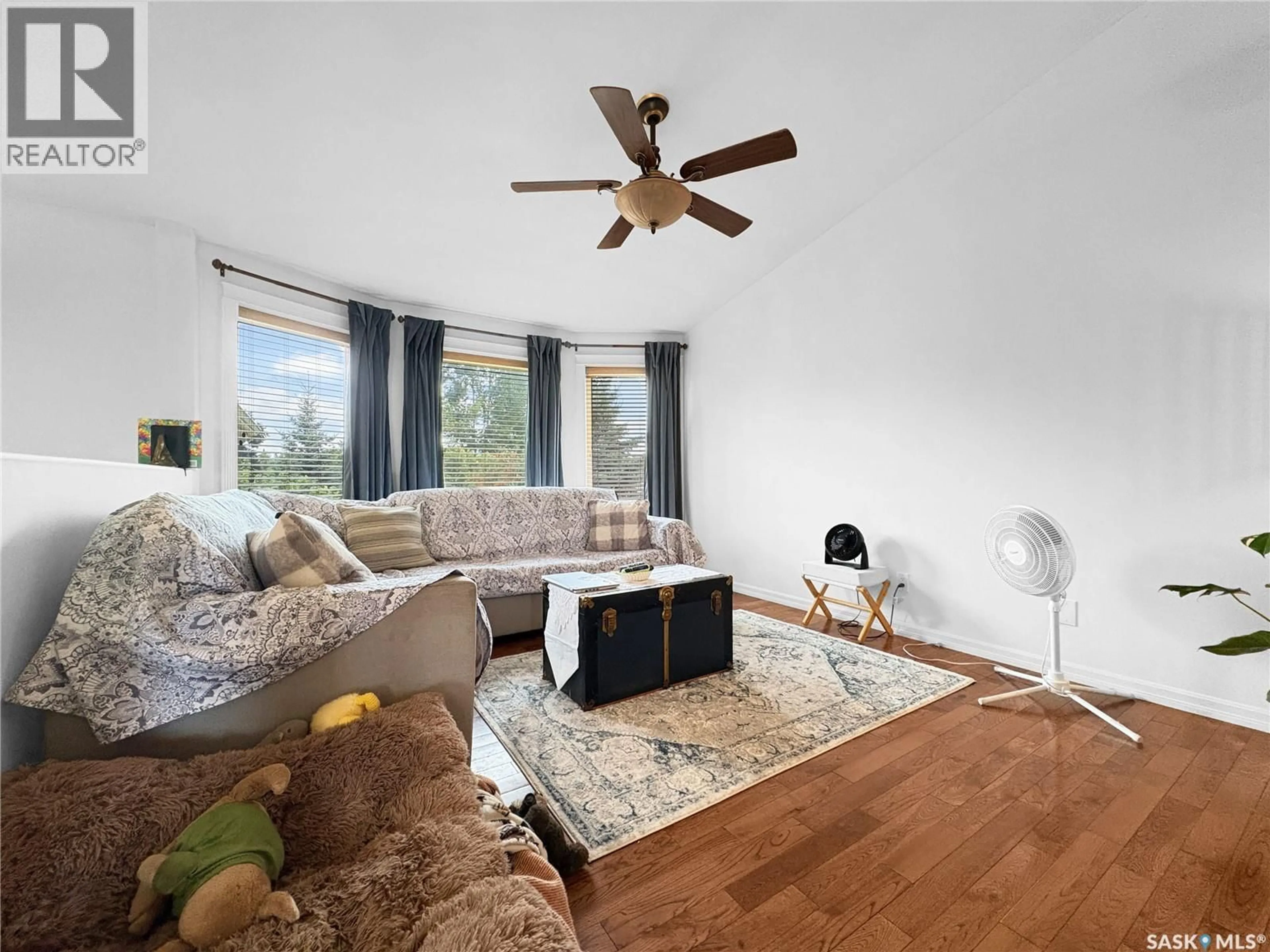 Living room with furniture, wood/laminate floor for 506 2ND AVENUE PLACE, Radisson Saskatchewan S0K3L0