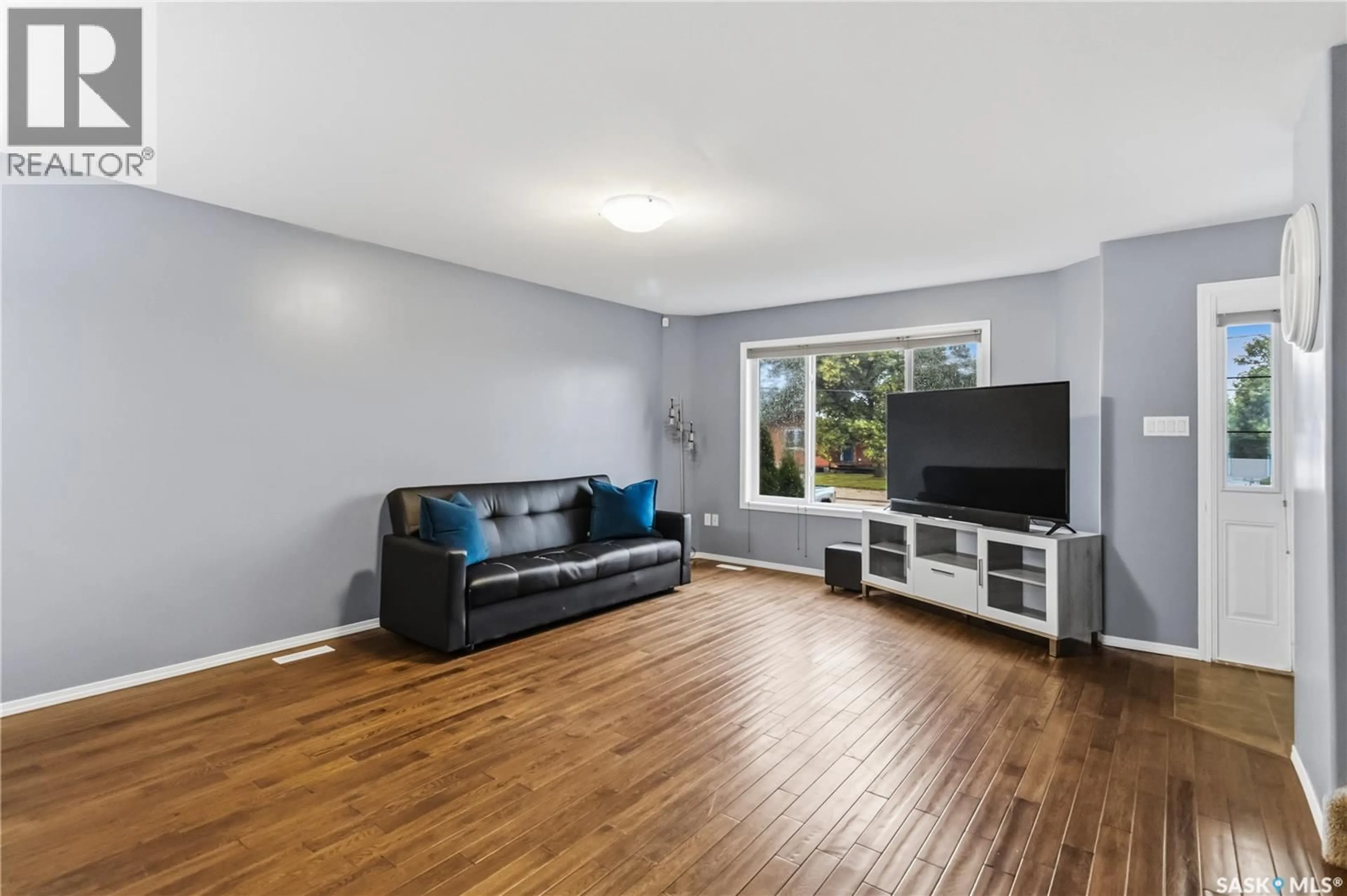 Living room with furniture, wood/laminate floor for 205B 3RD AVENUE, Aberdeen Saskatchewan S0K0A0
