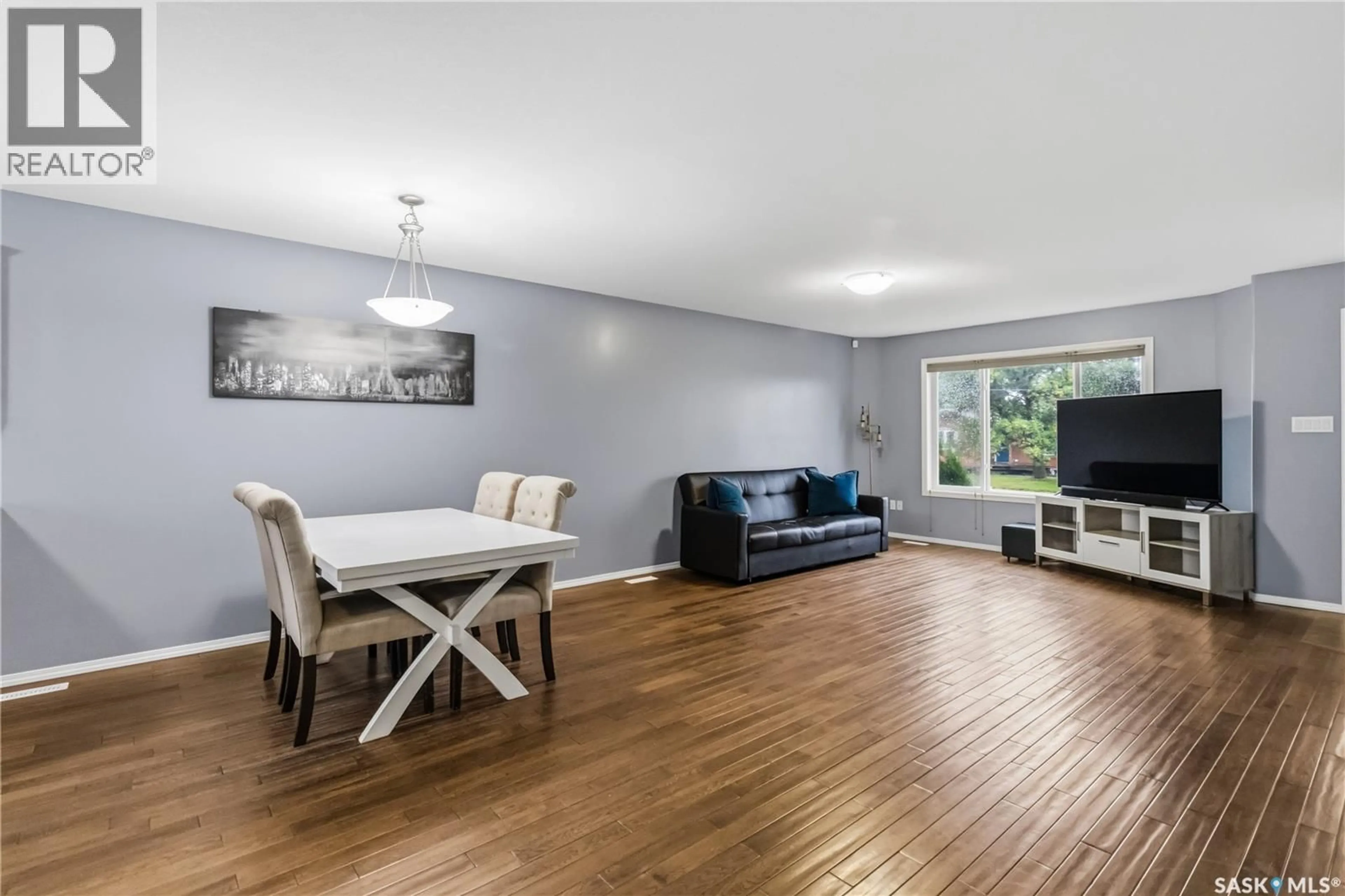 Living room with furniture, wood/laminate floor for 205B 3RD AVENUE, Aberdeen Saskatchewan S0K0A0