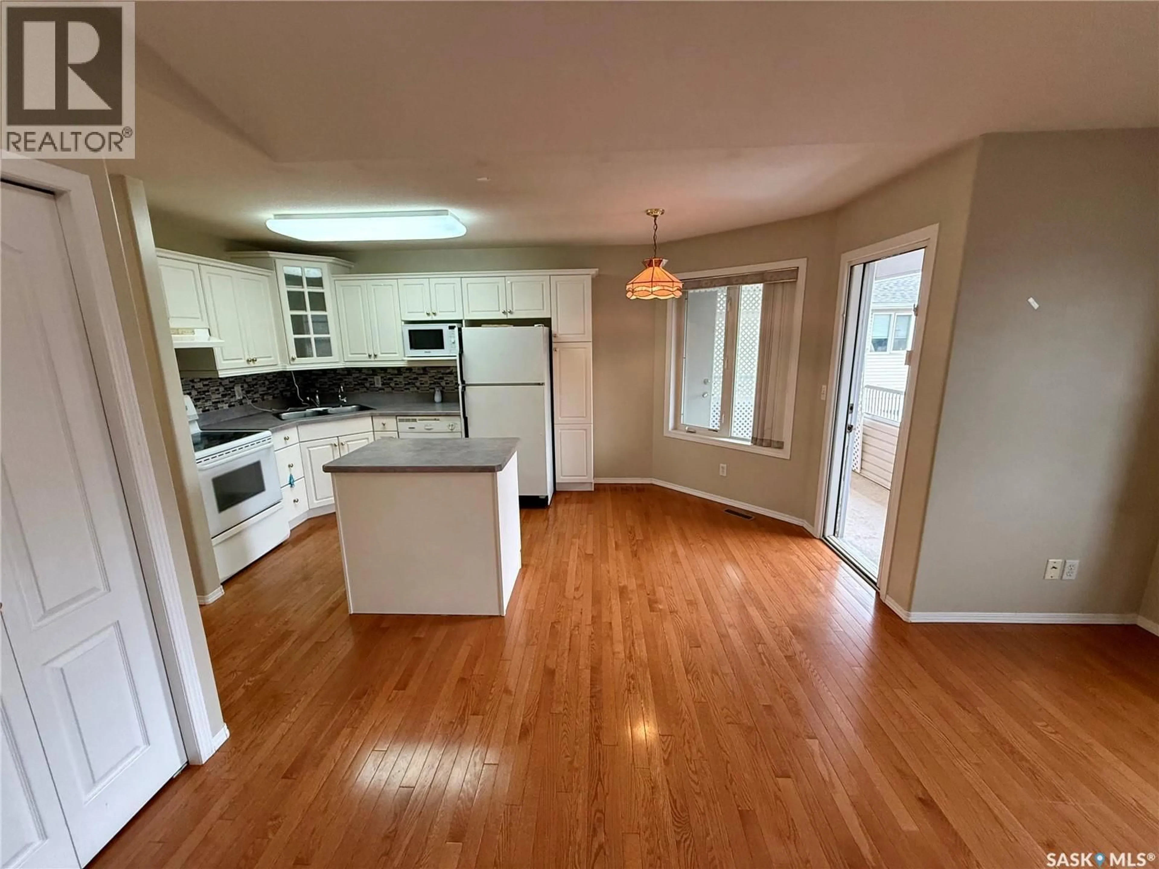 Open concept kitchen, wood/laminate floor for 3119 TRUESDALE DRIVE, Regina Saskatchewan S4V2P9