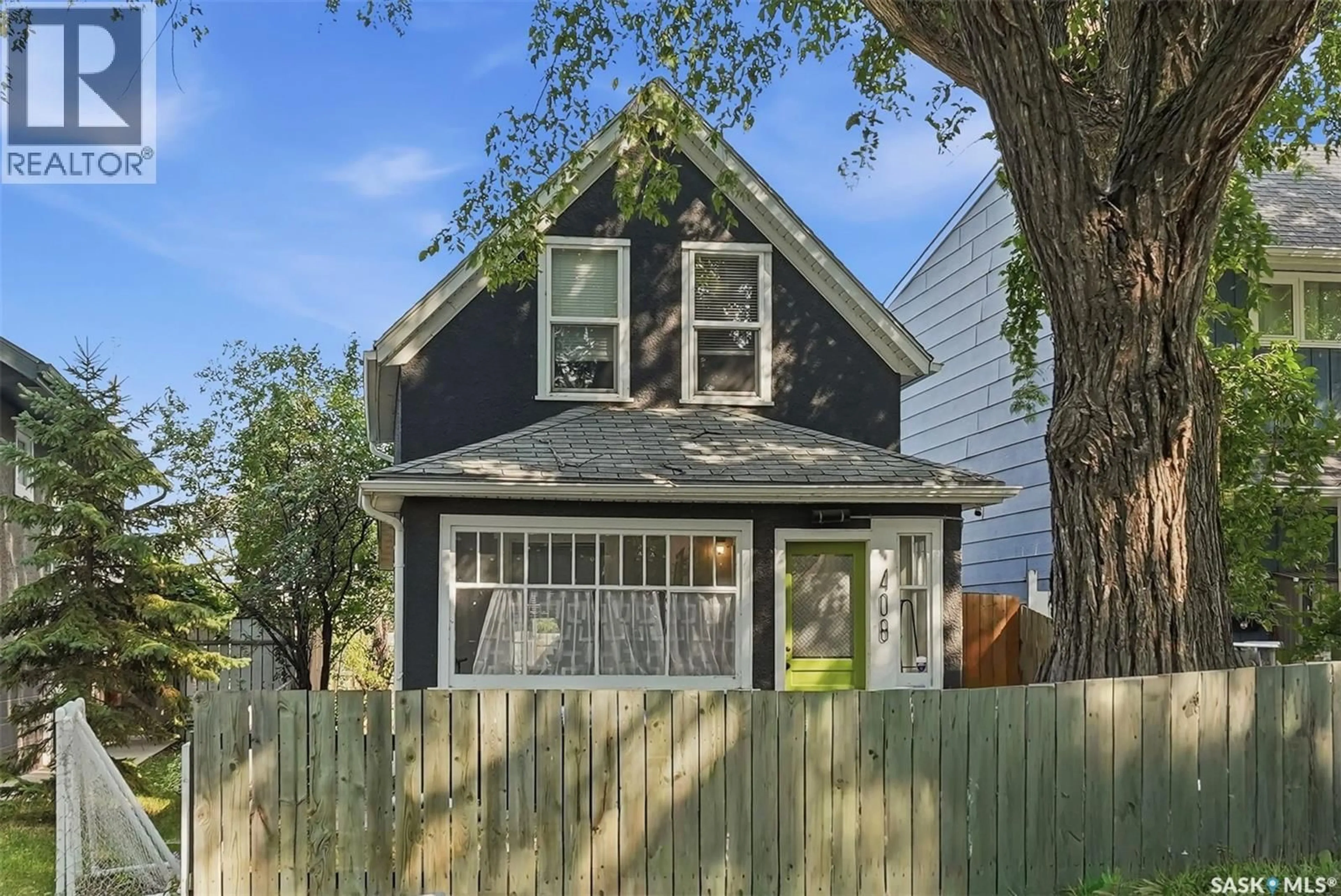 Home with vinyl exterior material, street for 408 E AVENUE S, Saskatoon Saskatchewan S7M1S3
