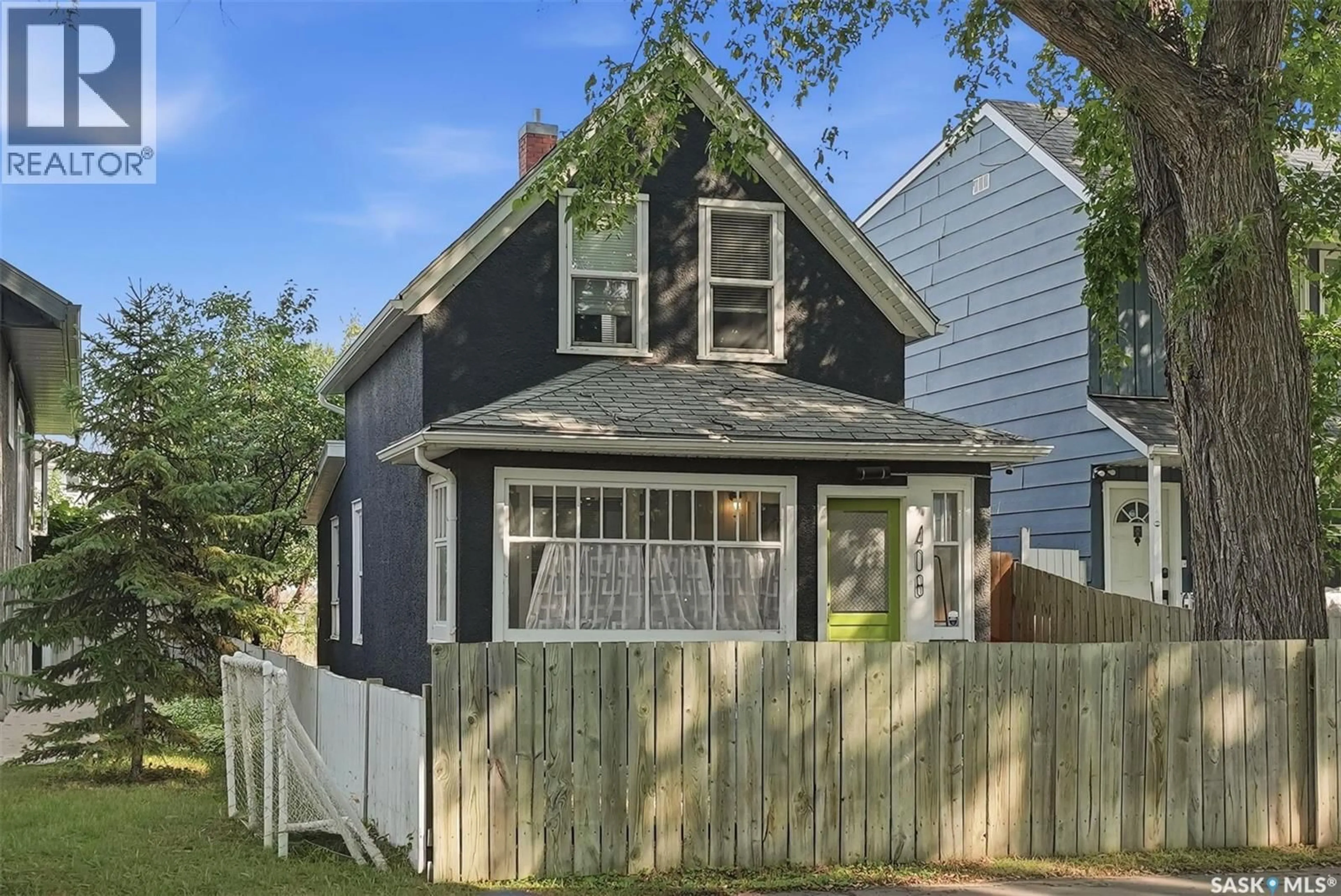 Home with vinyl exterior material, street for 408 E AVENUE S, Saskatoon Saskatchewan S7M1S3
