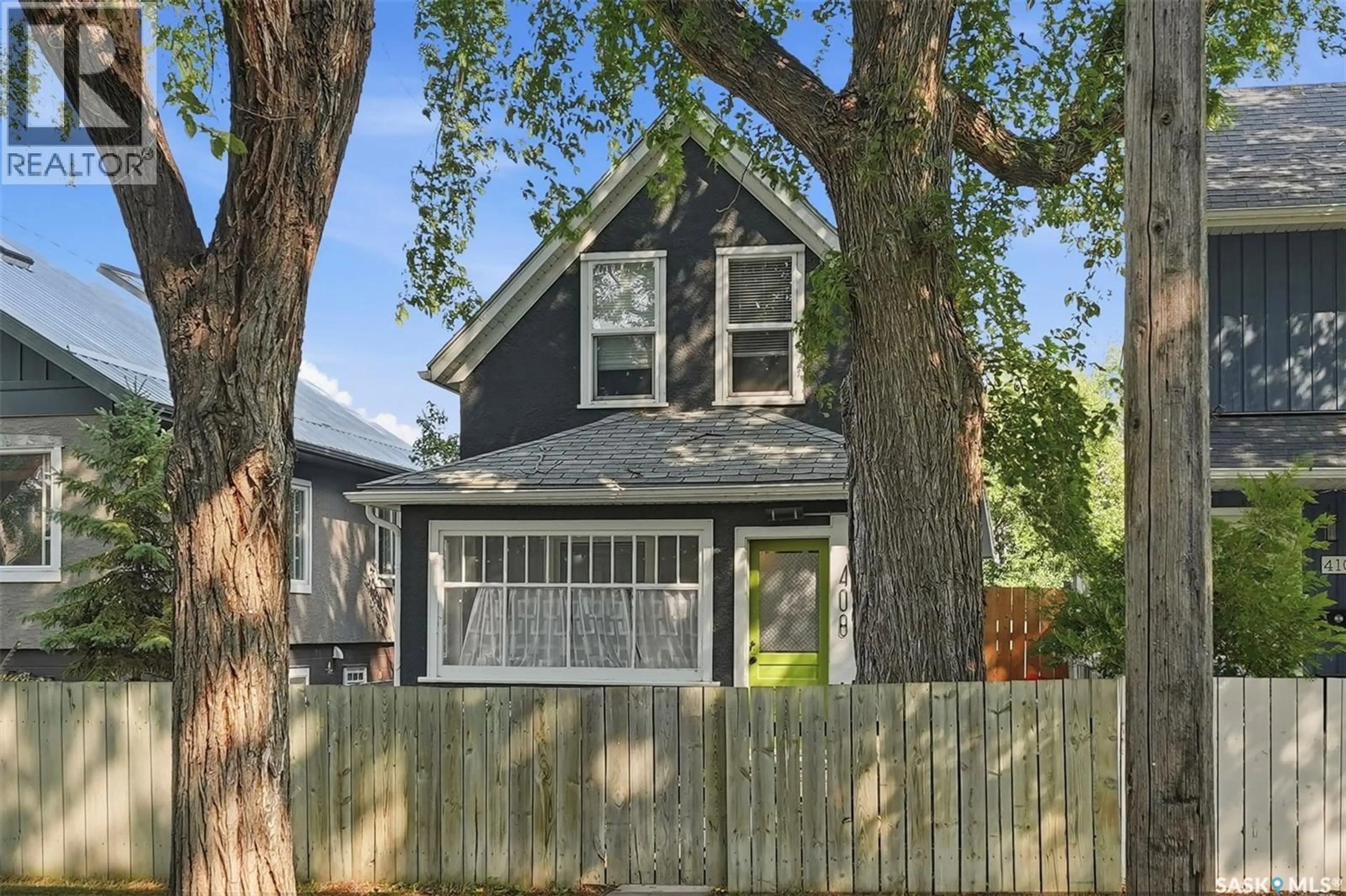 Home with vinyl exterior material, street for 408 E AVENUE S, Saskatoon Saskatchewan S7M1S3