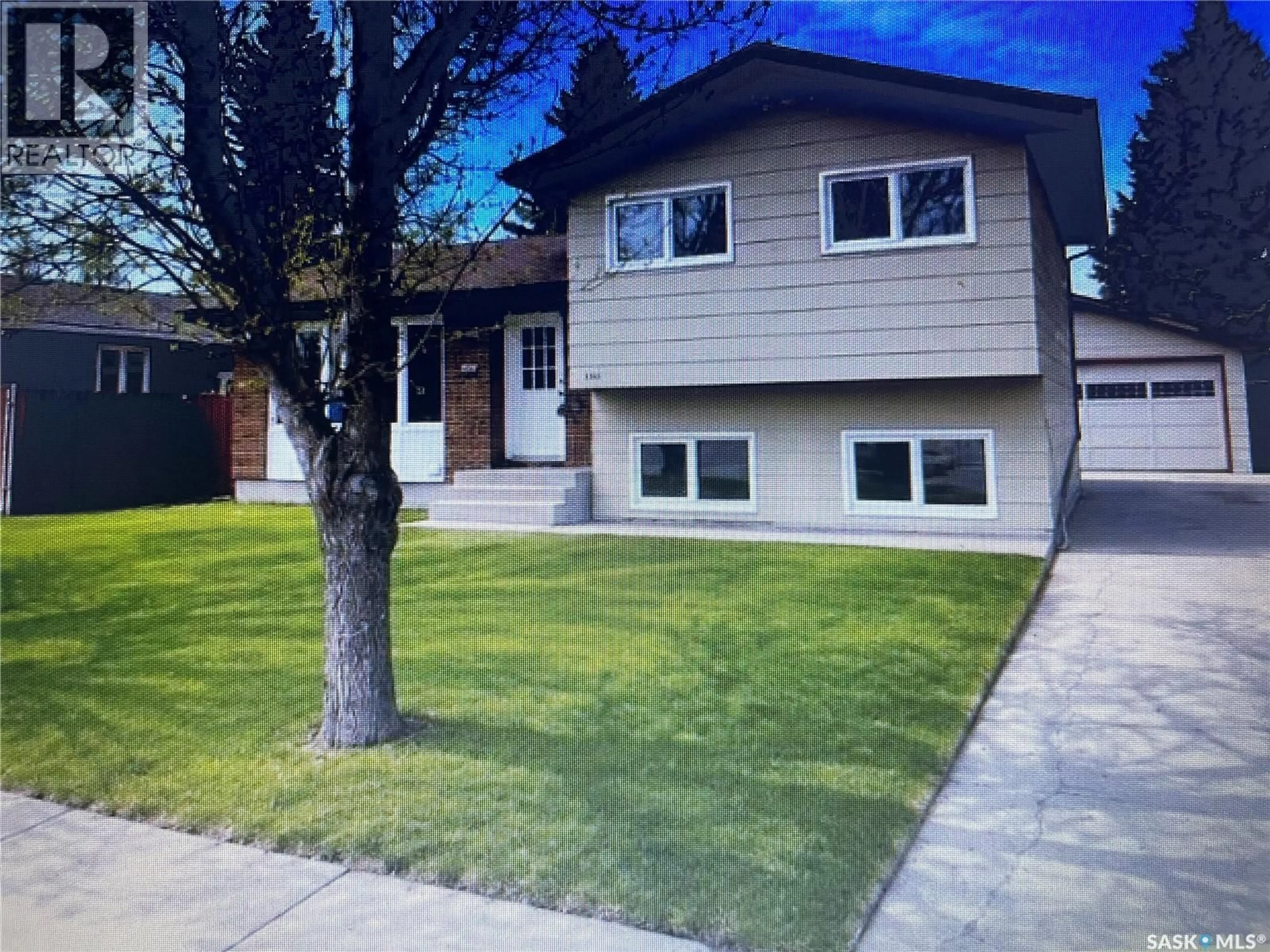 Home with vinyl exterior material, street for 1510 MCKERCHER DRIVE, Saskatoon Saskatchewan S7H5J9
