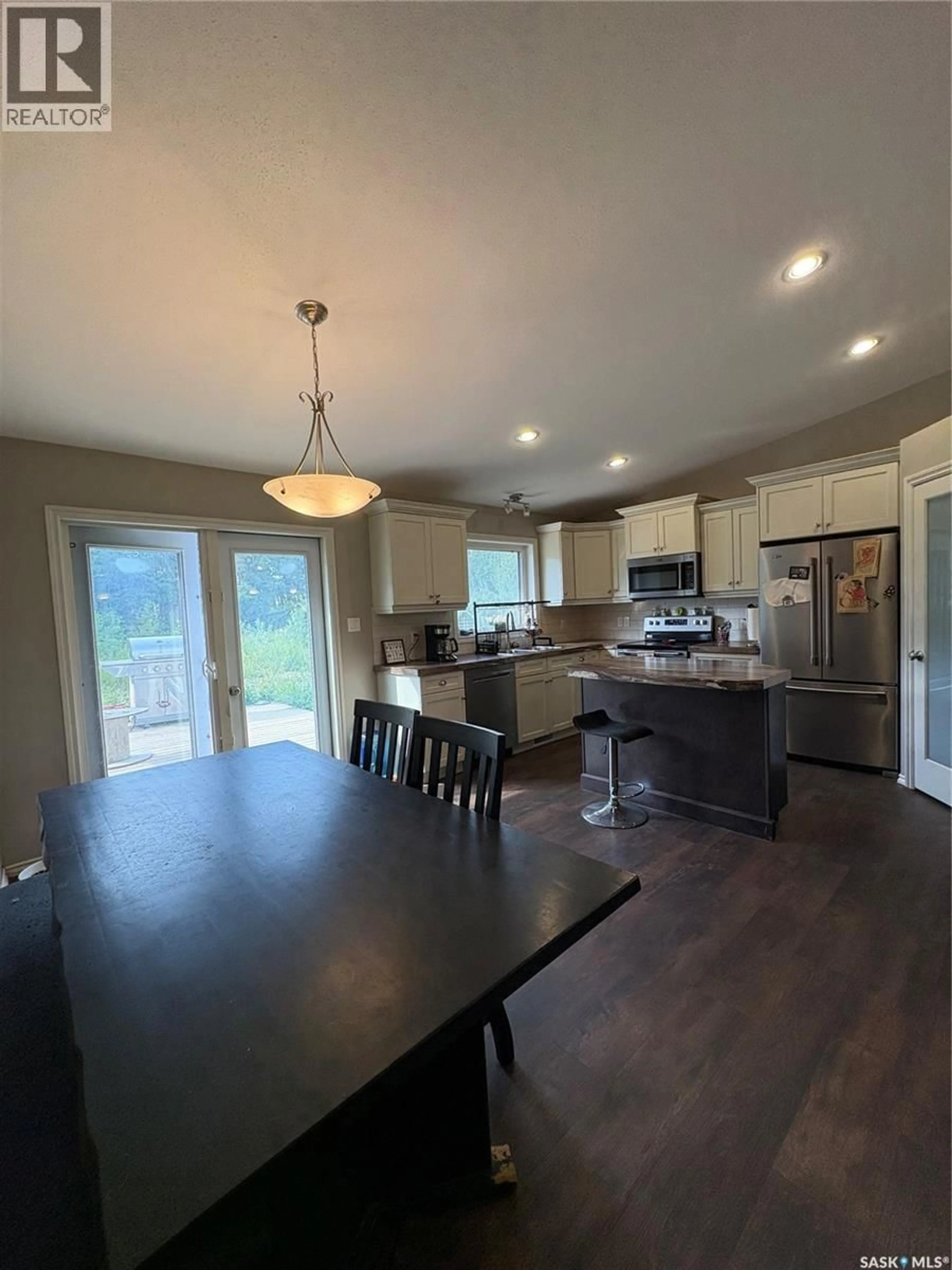 Open concept kitchen, wood/laminate floor for Rm OF LIVINGSTONE ACREAGE, Livingston Rm No. 331 Saskatchewan S0A0B0