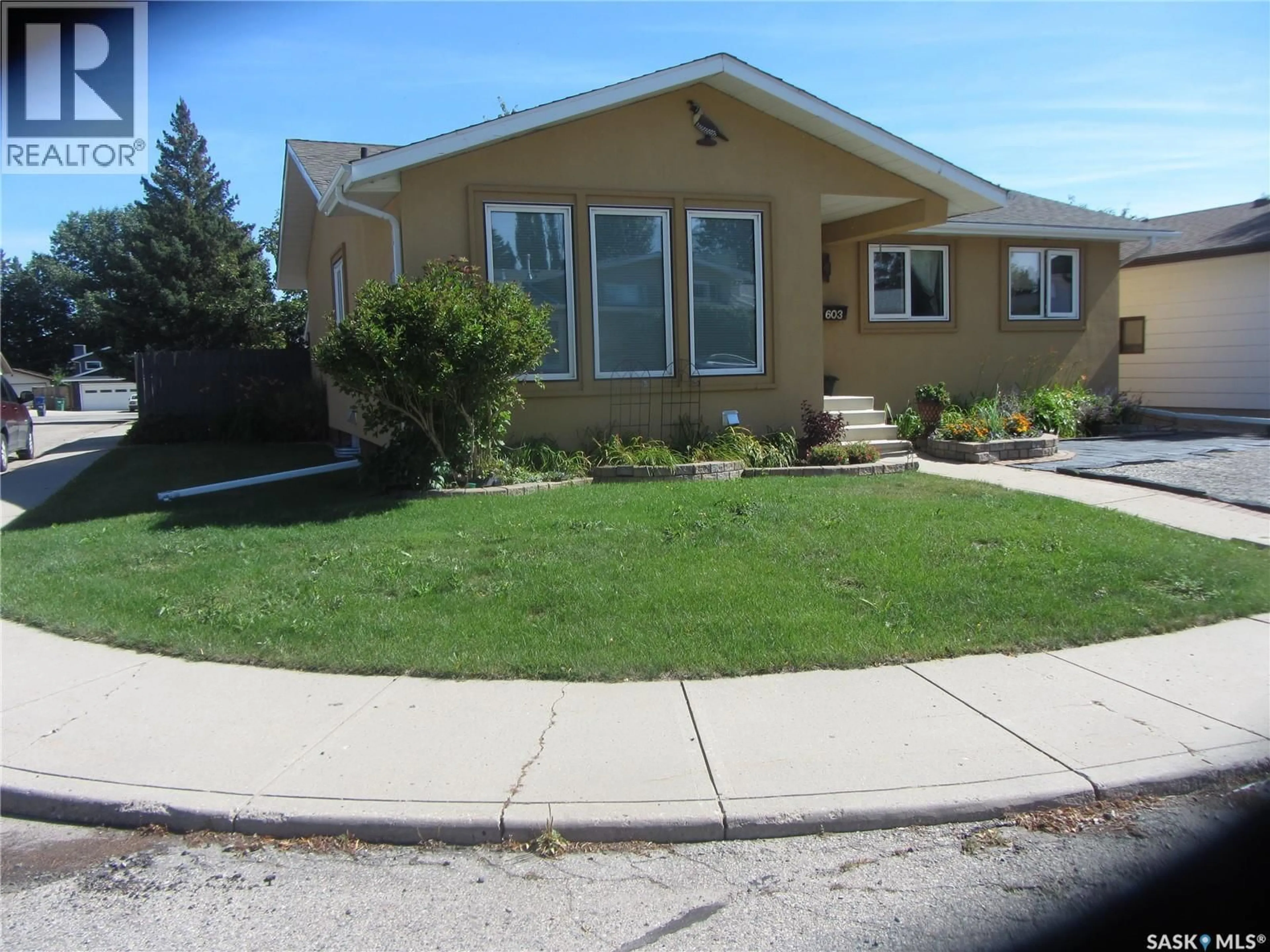 Home with vinyl exterior material, street for 603 CHRISTOPHER WAY, Saskatoon Saskatchewan S7J3S3