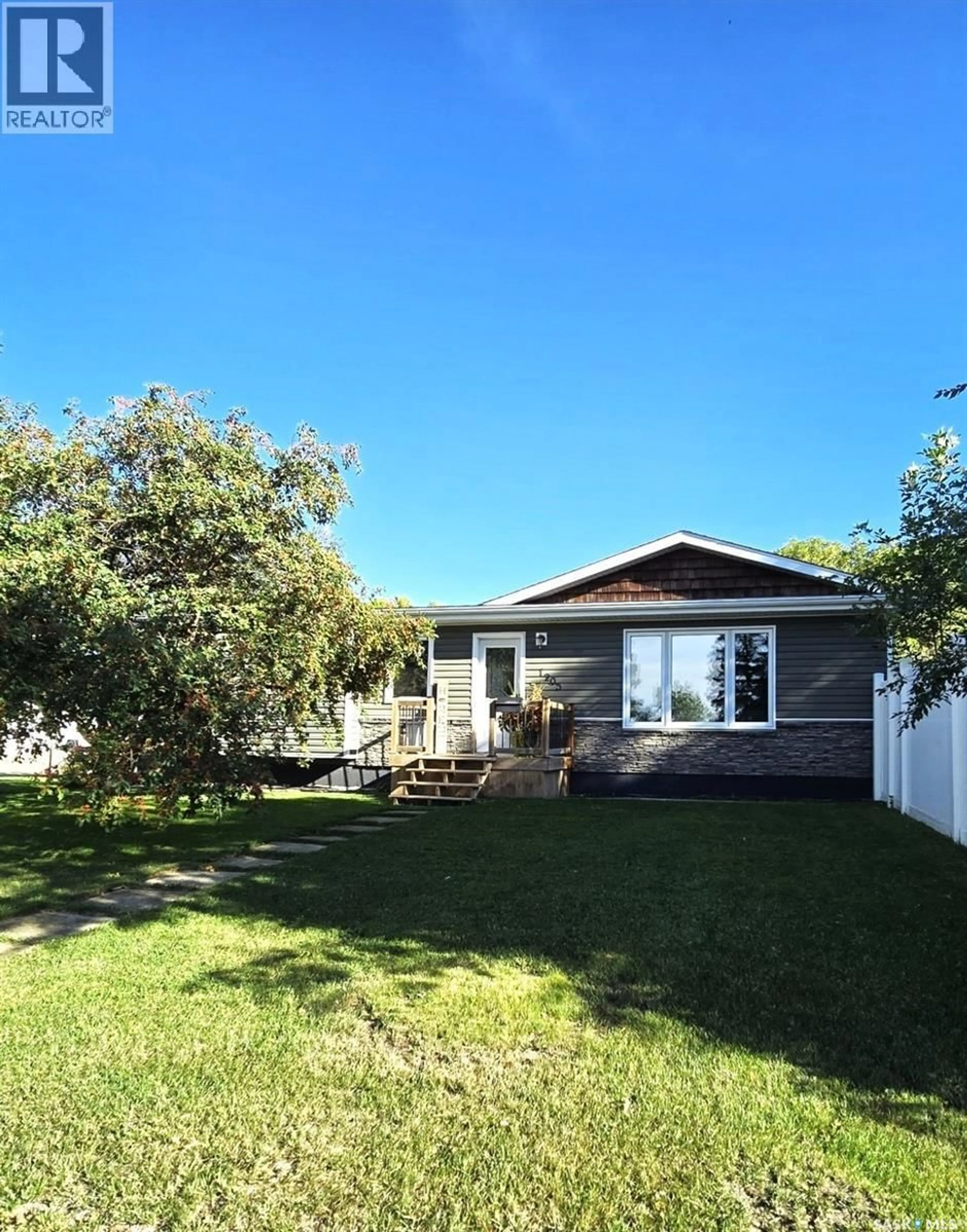 A pic from outside/outdoor area/front of a property/back of a property/a pic from drone, street for 1205 DOUGLAS ROAD, Weyburn Saskatchewan S4H2P9