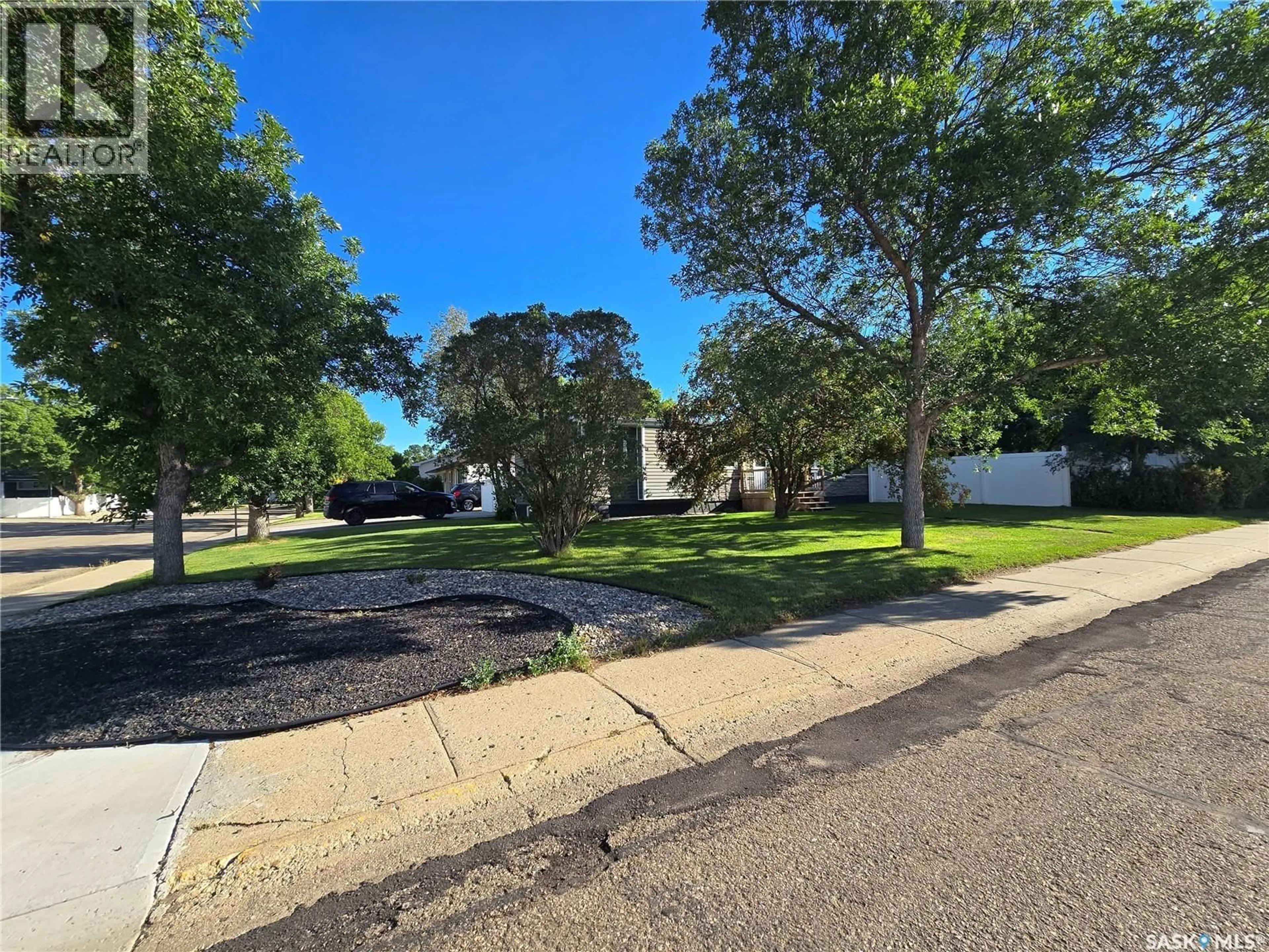 A pic from outside/outdoor area/front of a property/back of a property/a pic from drone, street for 1205 DOUGLAS ROAD, Weyburn Saskatchewan S4H2P9