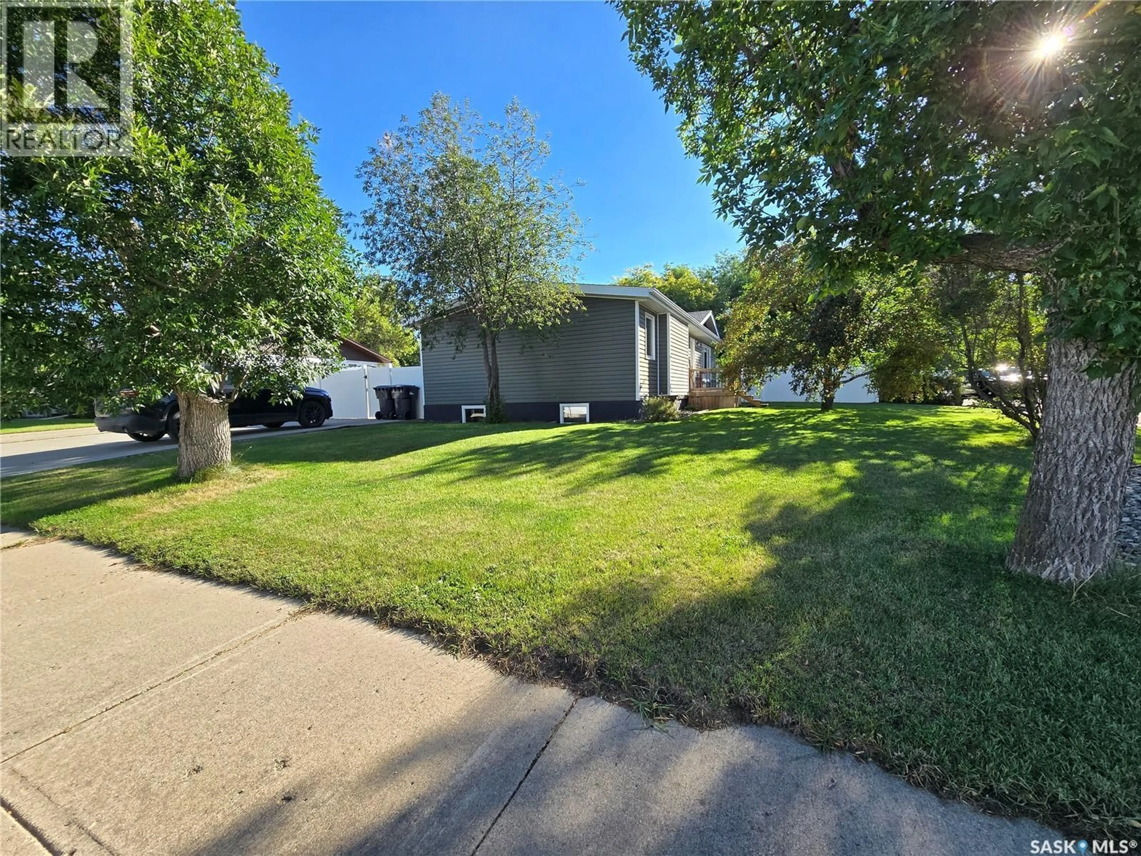 A pic from outside/outdoor area/front of a property/back of a property/a pic from drone, street for 1205 DOUGLAS ROAD, Weyburn Saskatchewan S4H2P9