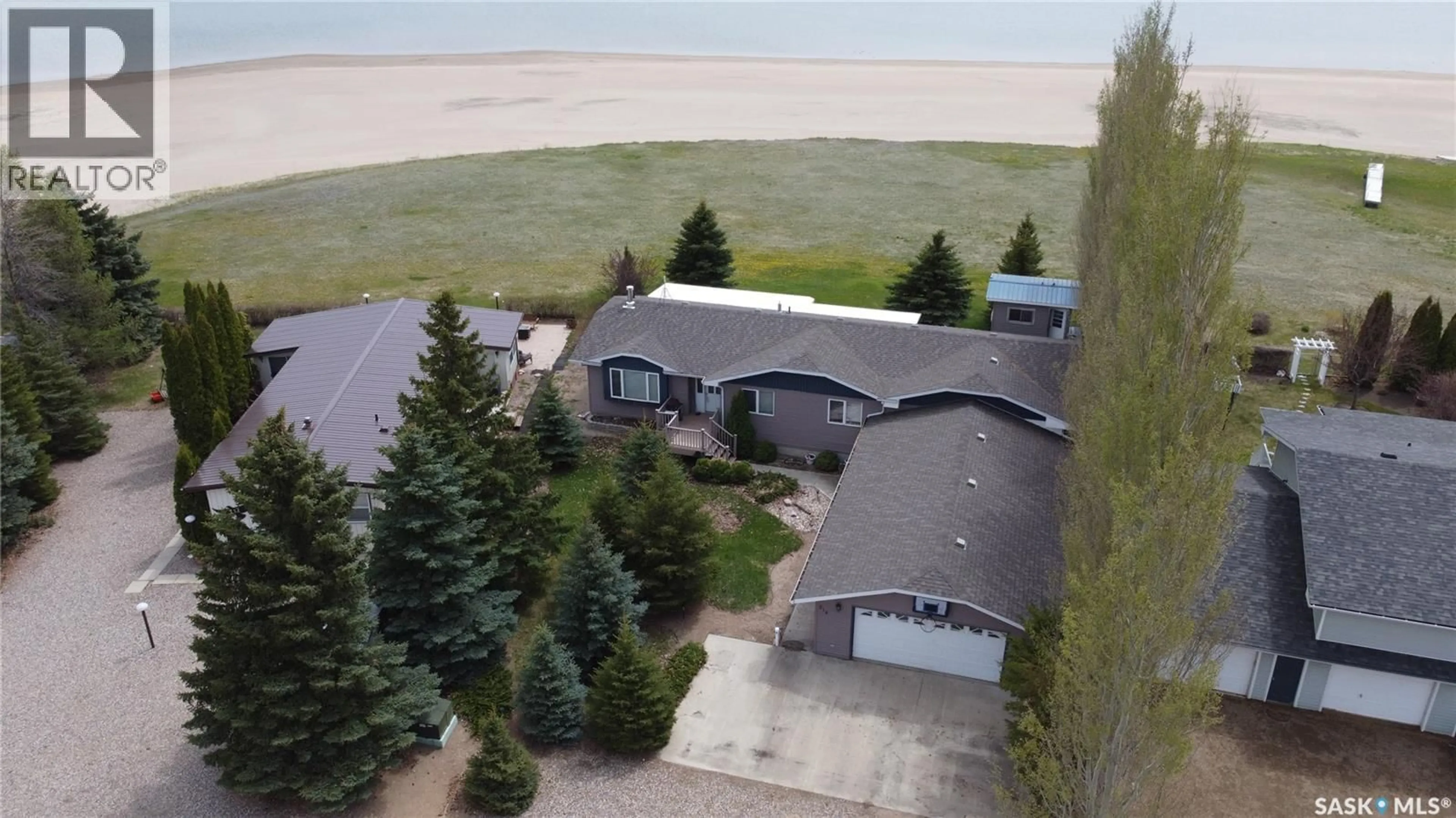 A pic from outside/outdoor area/front of a property/back of a property/a pic from drone, water/lake/river/ocean view for 218 RUBY DRIVE, Coteau Rm No. 255 Saskatchewan S0L0G0