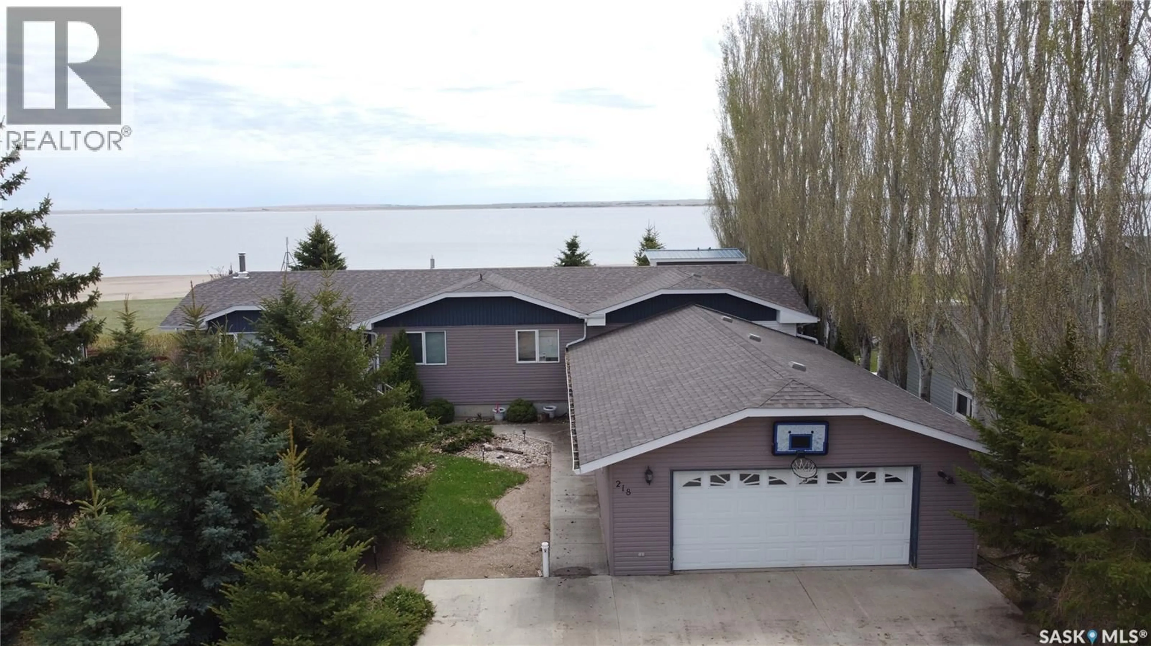 A pic from outside/outdoor area/front of a property/back of a property/a pic from drone, water/lake/river/ocean view for 218 RUBY DRIVE, Coteau Rm No. 255 Saskatchewan S0L0G0