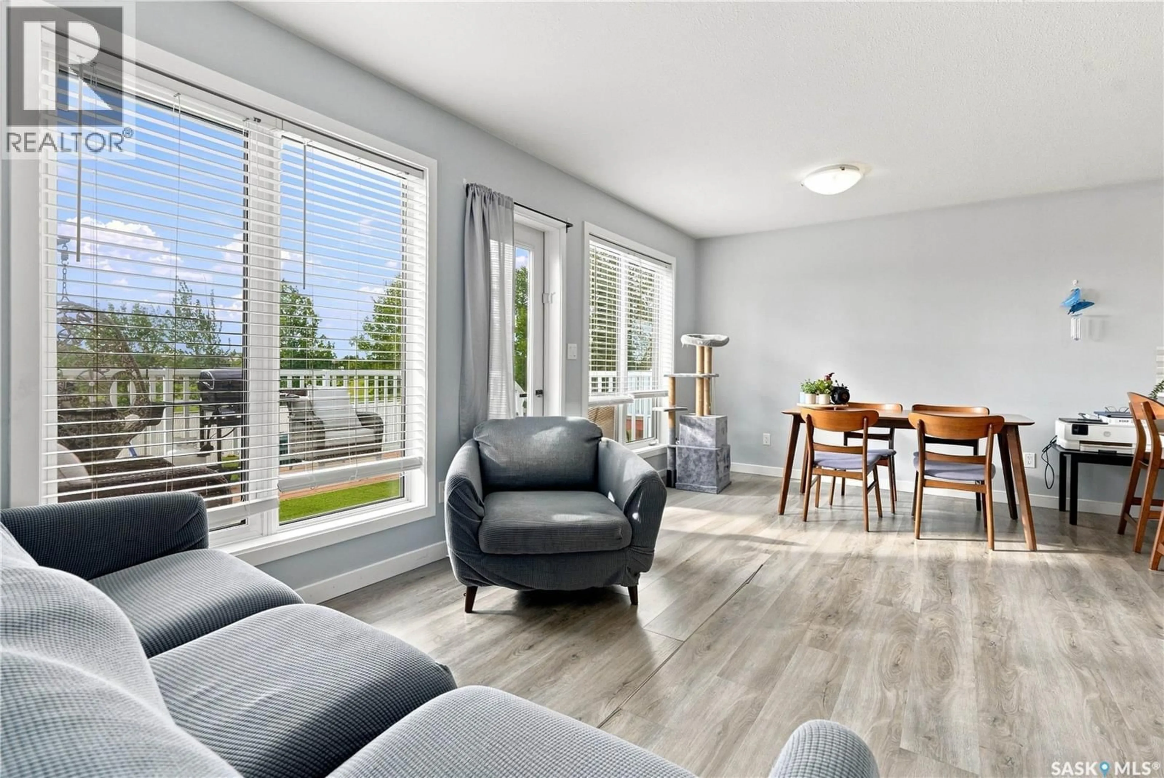 Living room with furniture, wood/laminate floor for 515 - 9 CENTENNIAL BOULEVARD, Warman Saskatchewan S0K0A1