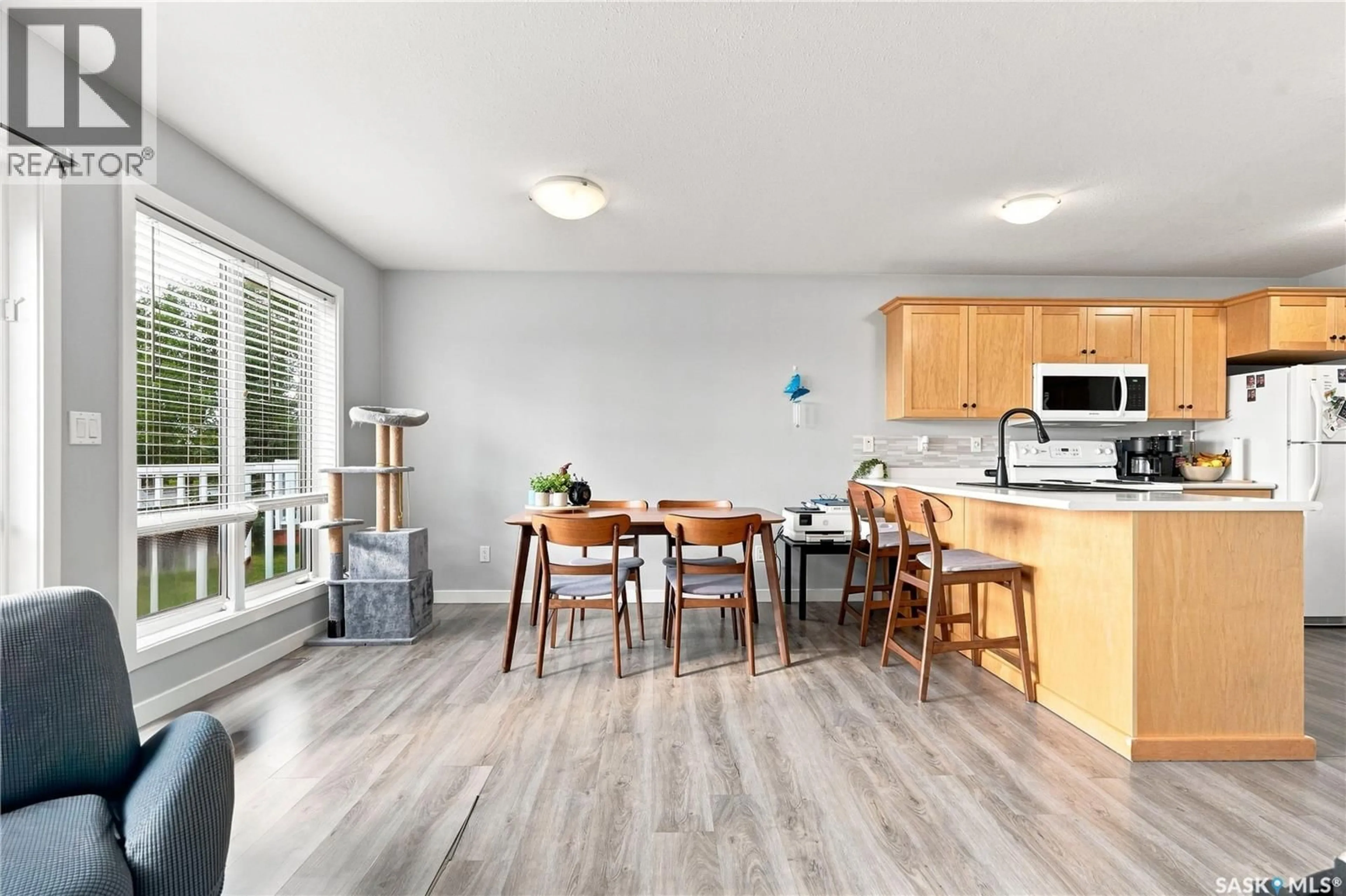 Open concept kitchen, wood/laminate floor for 515 - 9 CENTENNIAL BOULEVARD, Warman Saskatchewan S0K0A1