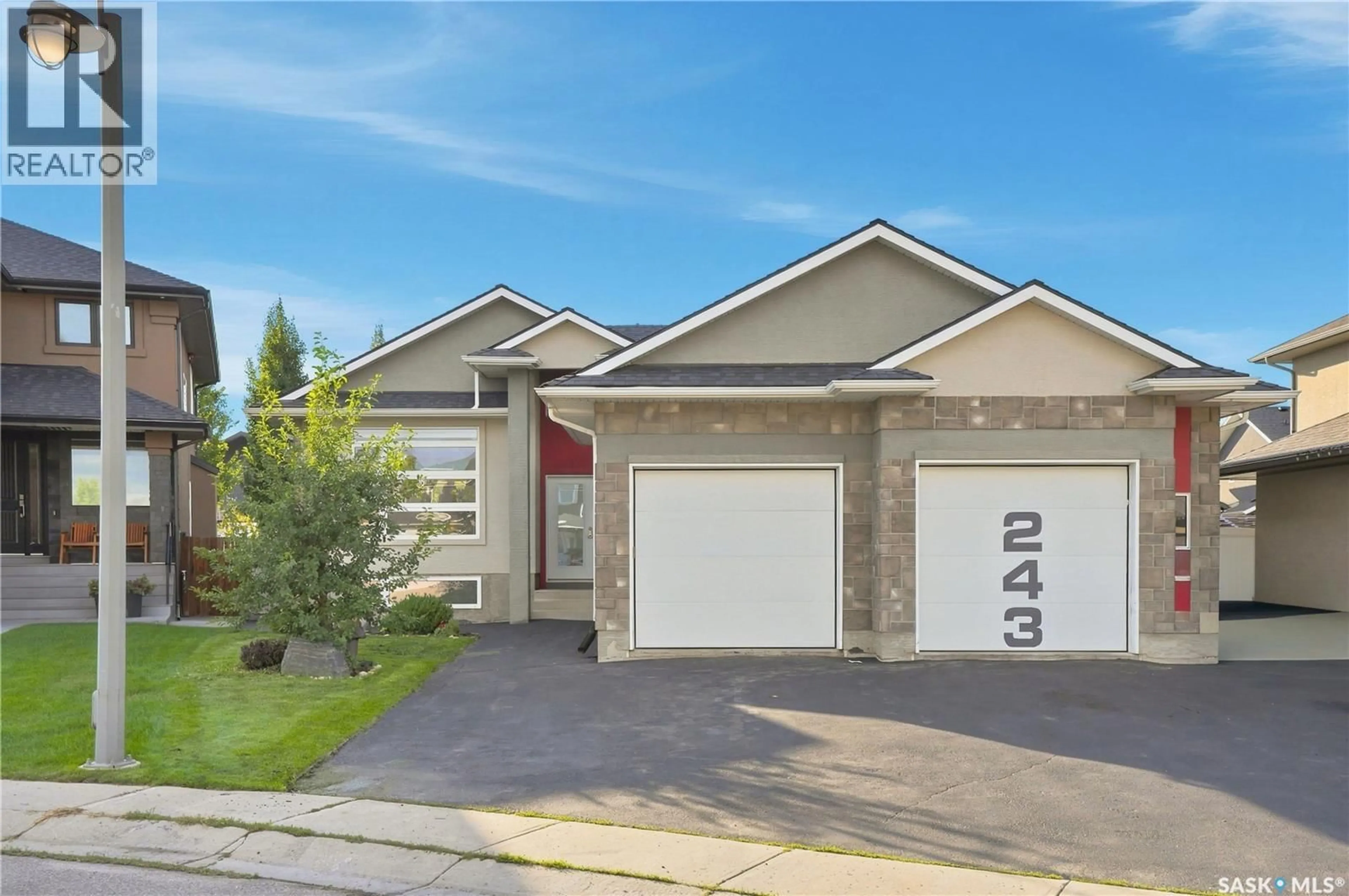 Home with vinyl exterior material, street for 243 TEAL TERRACE, Saskatoon Saskatchewan S7T0P9
