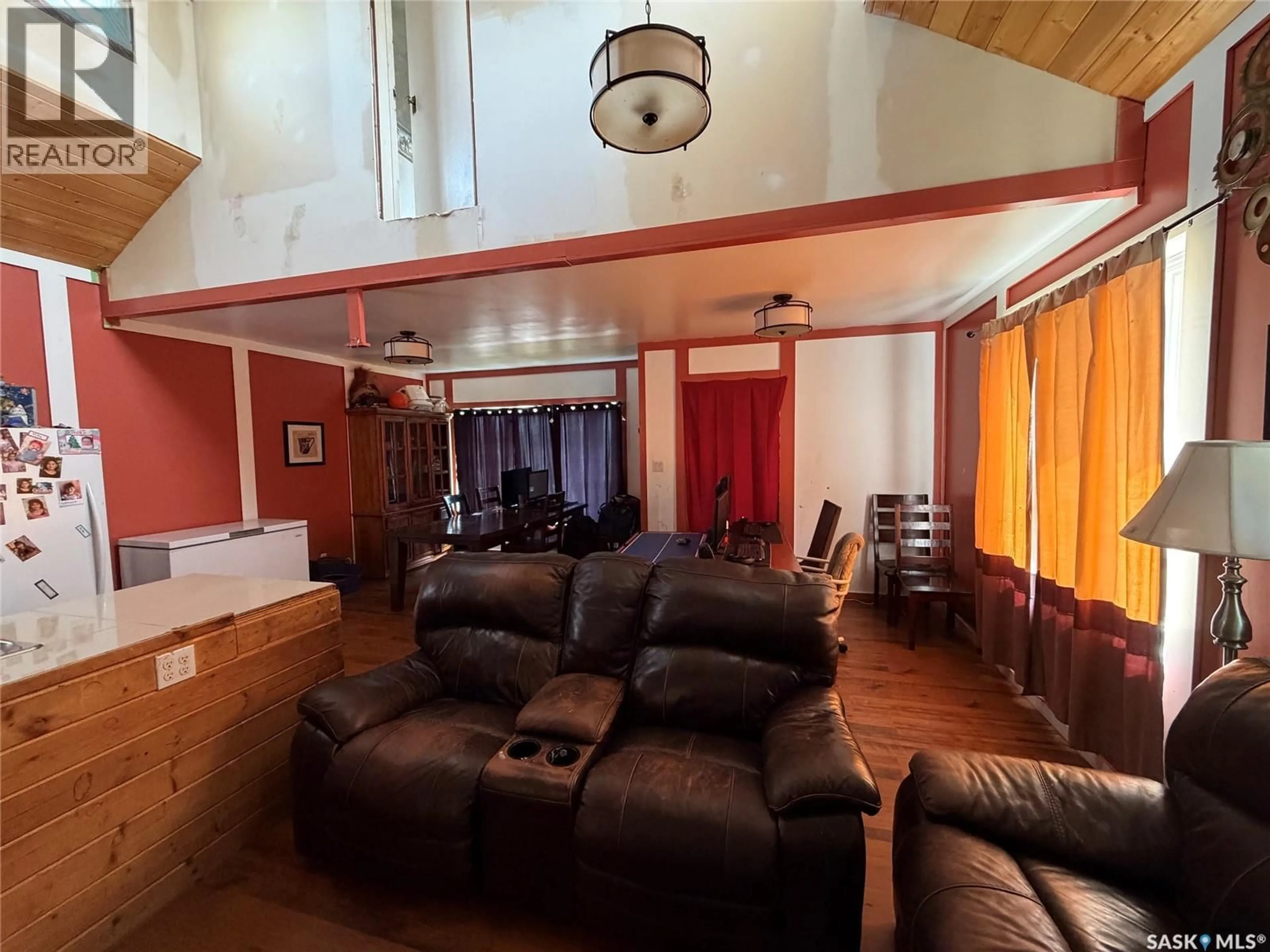 Living room with furniture, wood/laminate floor for 207 MAIN STREET, Hudson Bay Saskatchewan S0E0Y0