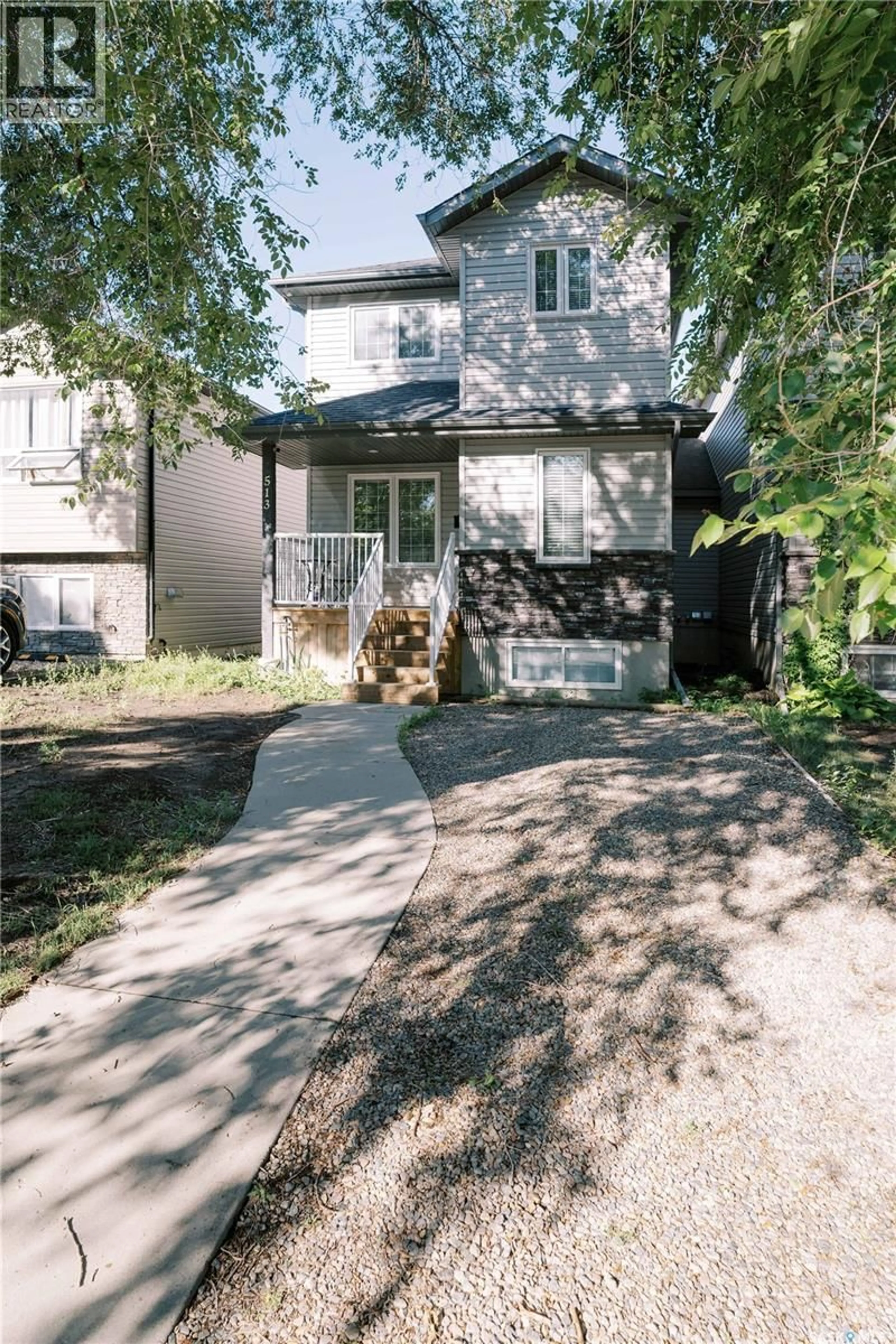 Home with brick exterior material, street for 513 L AVENUE N, Saskatoon Saskatchewan S7L2P8