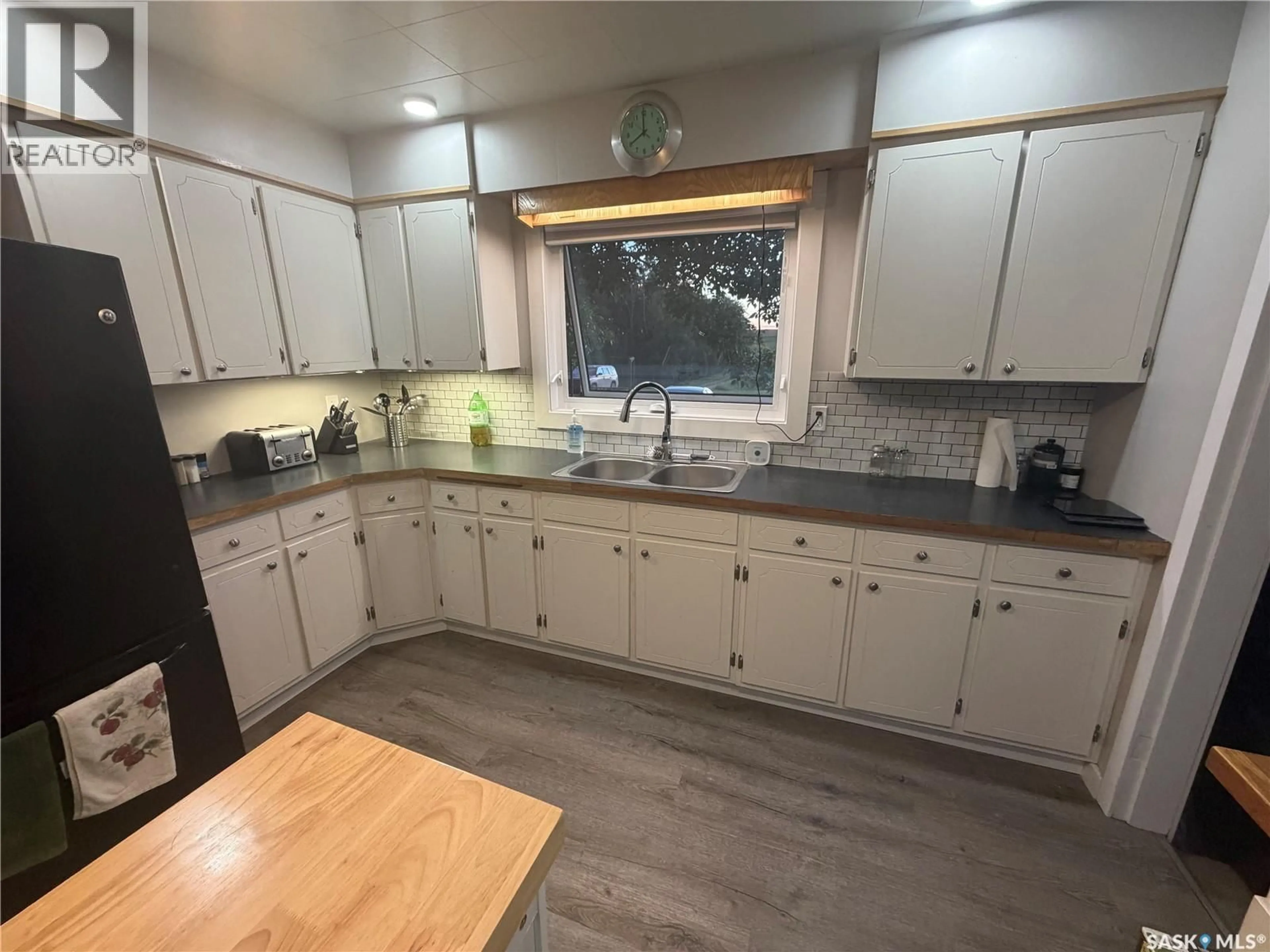 Open concept kitchen, wood/laminate floor for THIESSEN ACREAGE, Laird Rm No. 404 Saskatchewan S0K3R0