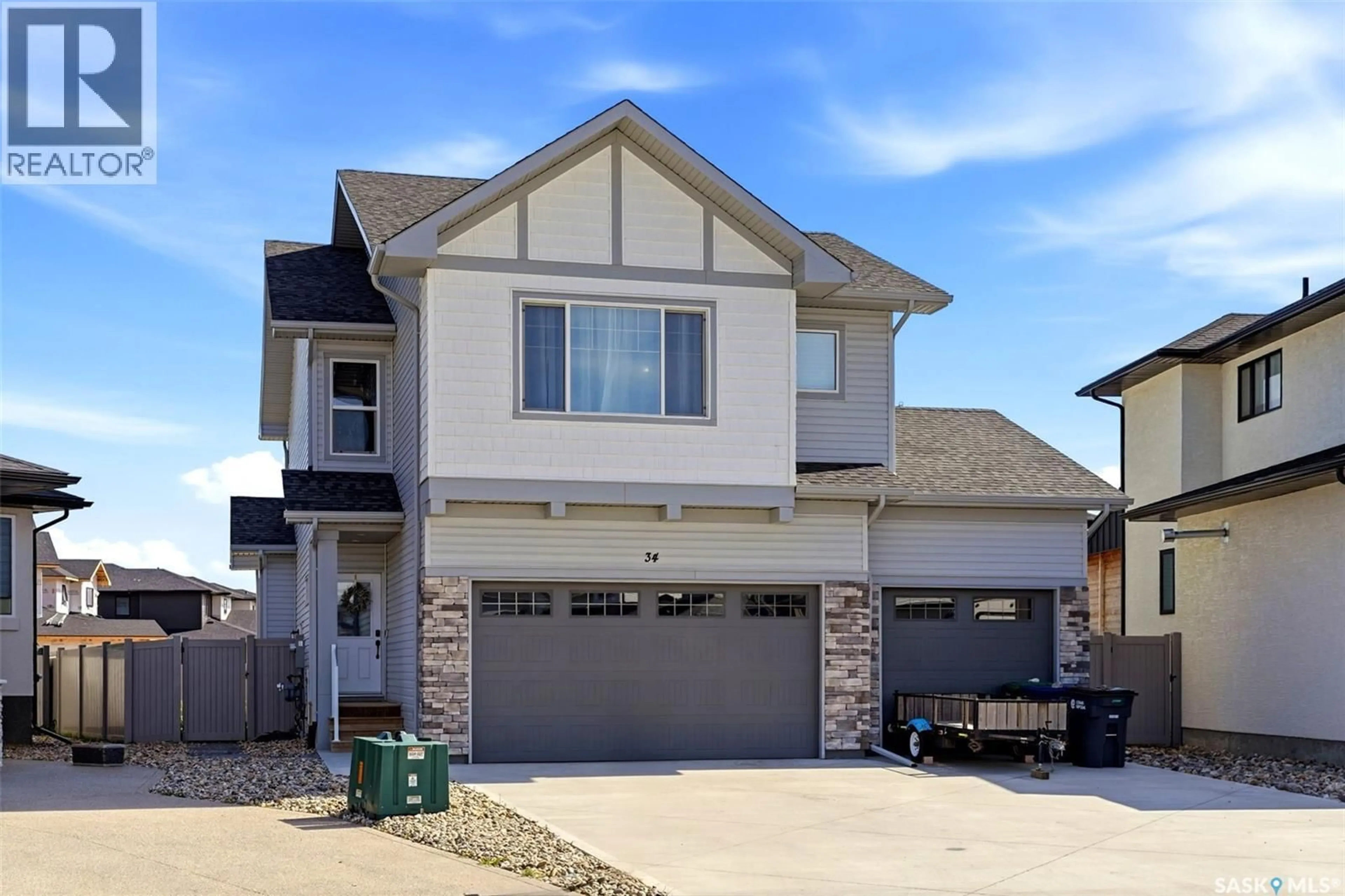 Home with vinyl exterior material, street for 34 MACKENZIE CRESCENT, Pilot Butte Saskatchewan S0G0Z0