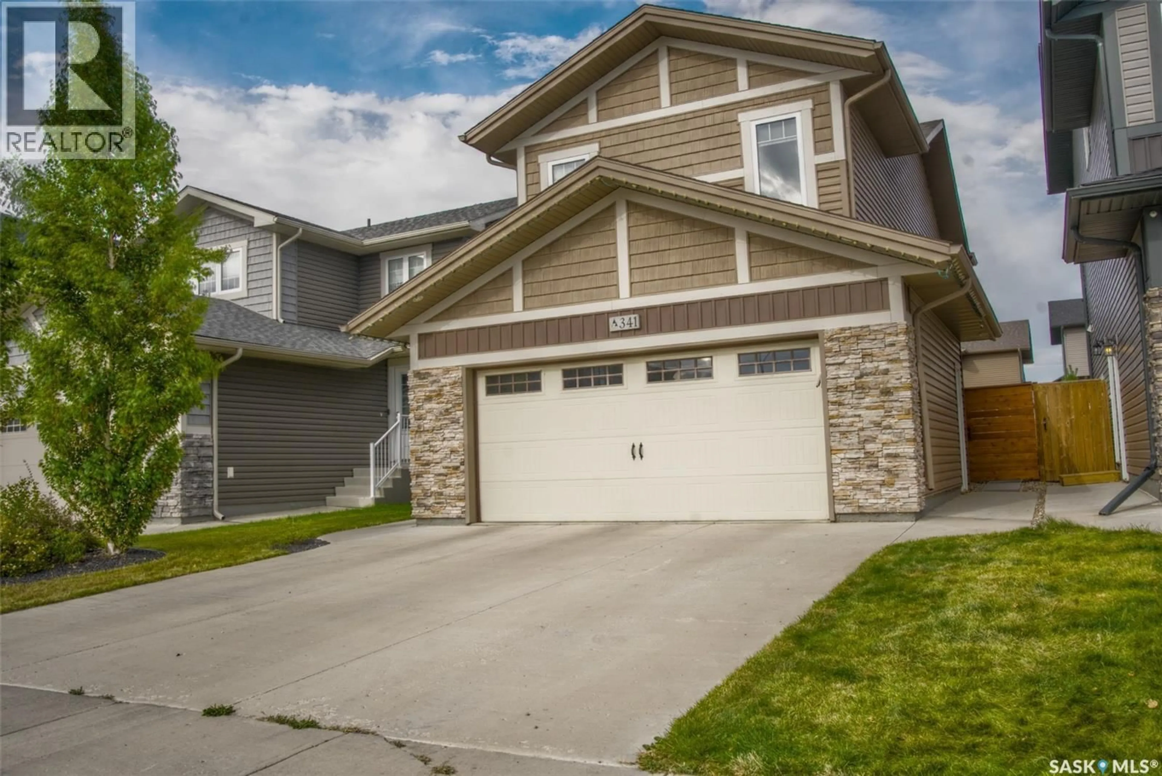 Home with vinyl exterior material, street for 341 GERMAIN MANOR, Saskatoon Saskatchewan S0K2T0