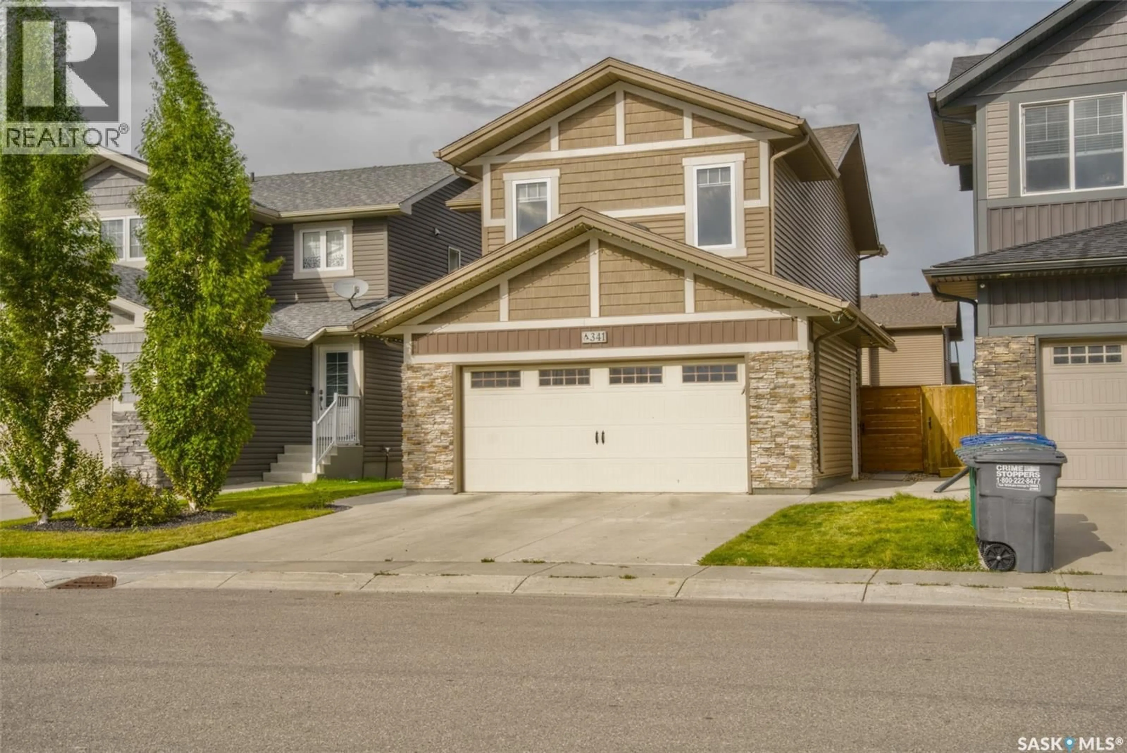 Home with vinyl exterior material, street for 341 GERMAIN MANOR, Saskatoon Saskatchewan S0K2T0