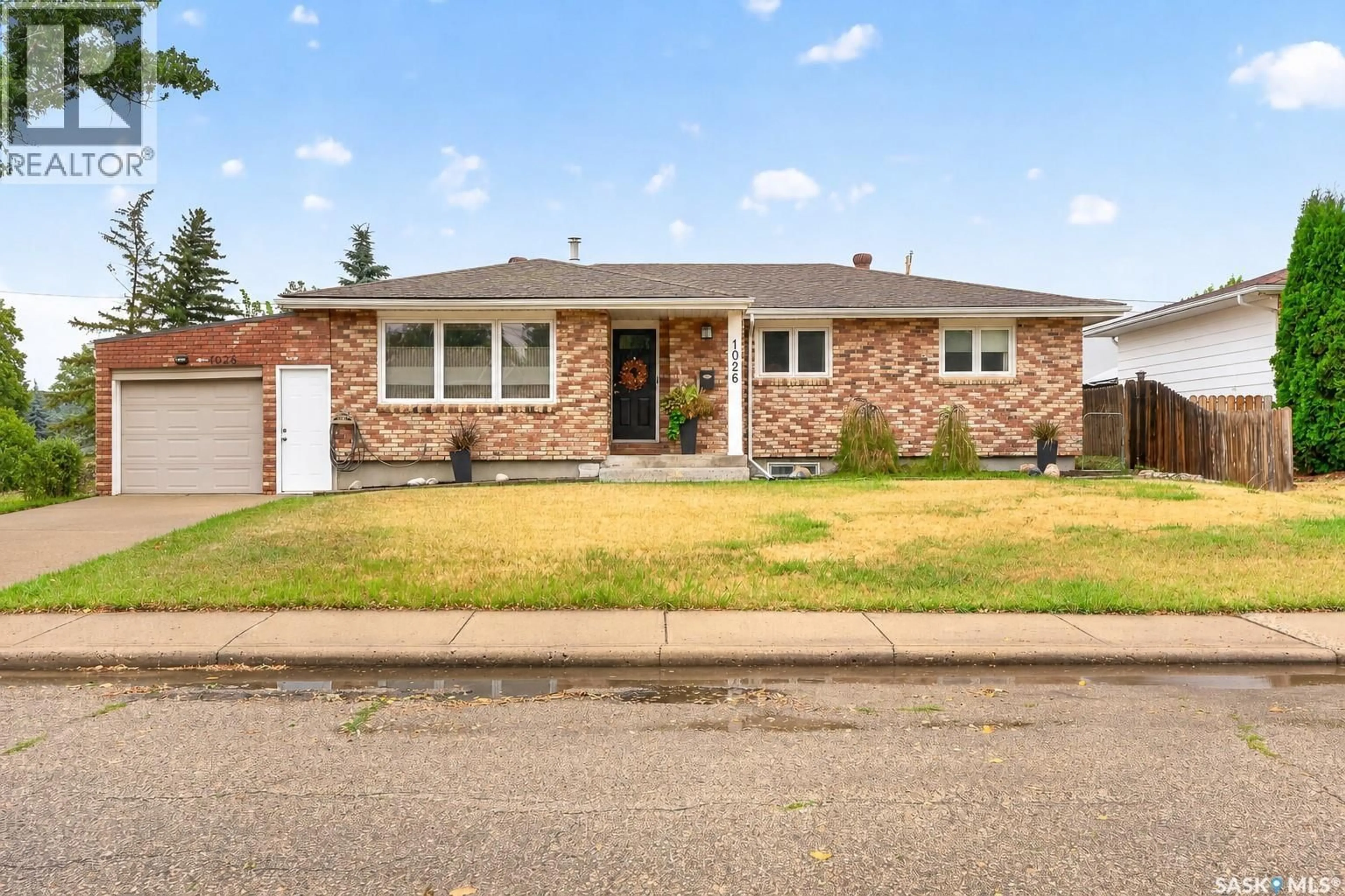 Home with brick exterior material, street for 1026 JAMES STREET, Moose Jaw Saskatchewan S6H3H7