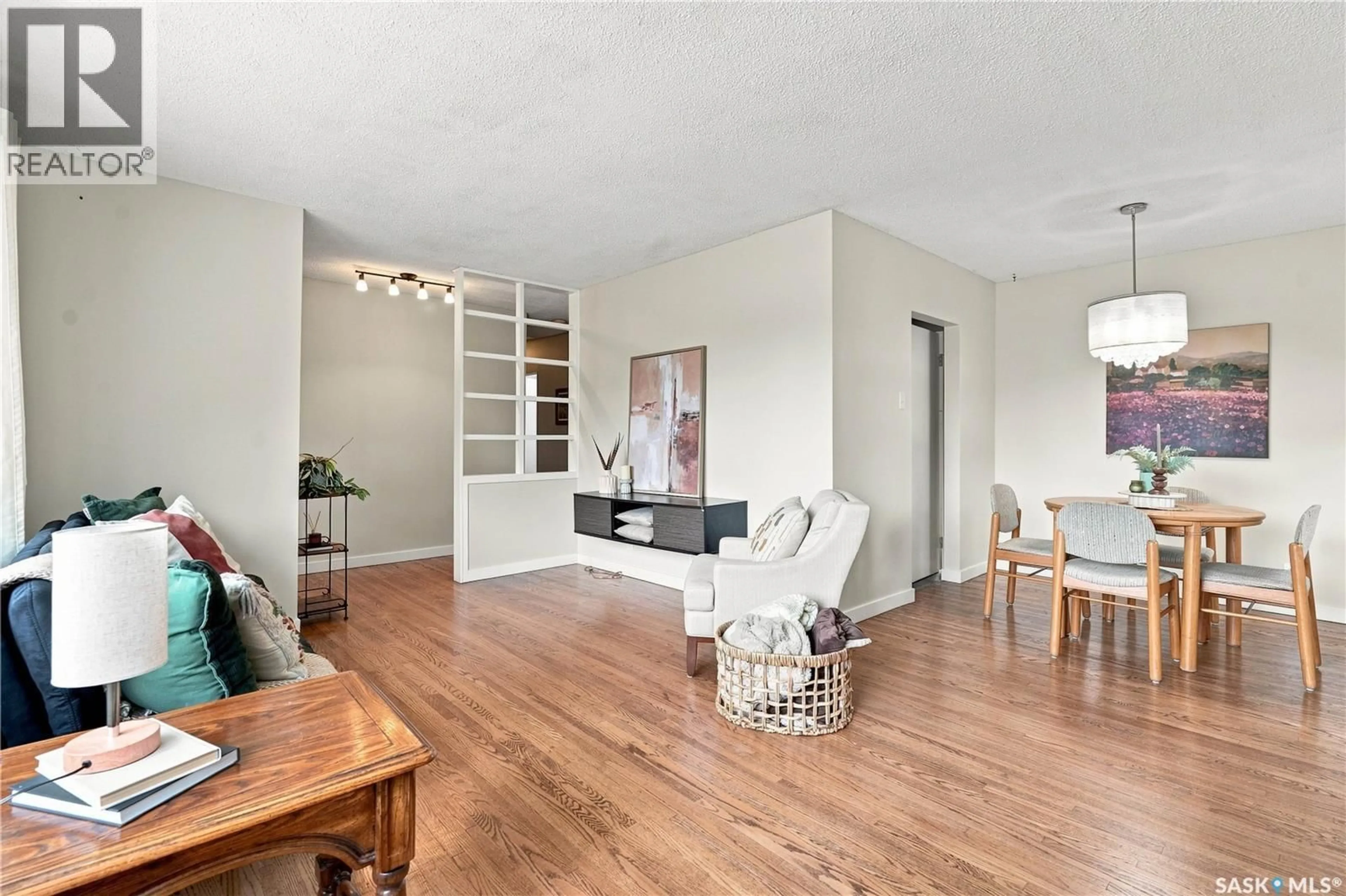 Living room with furniture, wood/laminate floor for 2302 HANOVER AVENUE, Saskatoon Saskatchewan S7J1E6