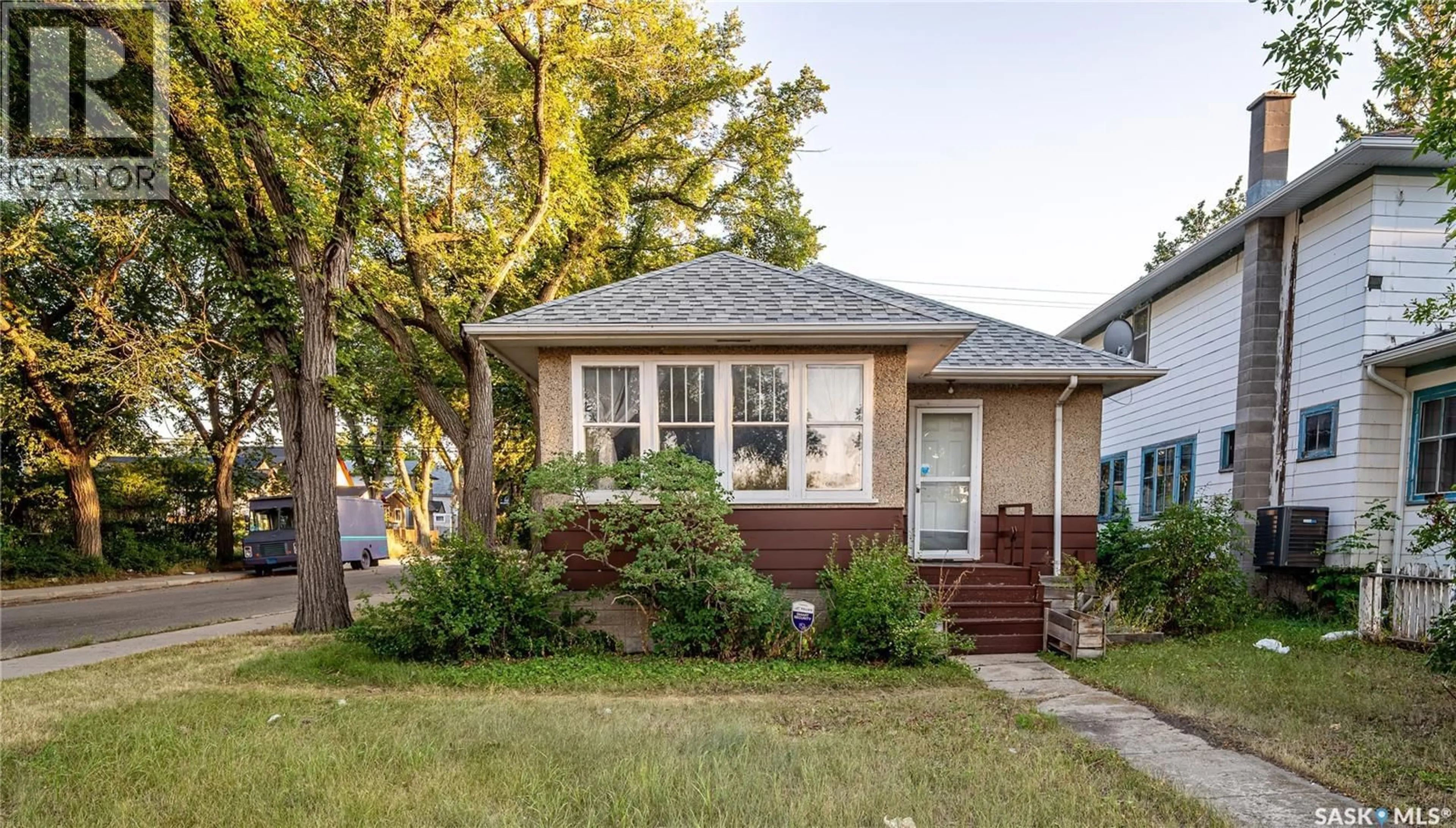 Home with vinyl exterior material, street for 3303 DEWDNEY AVENUE, Regina Saskatchewan S4T0Y9