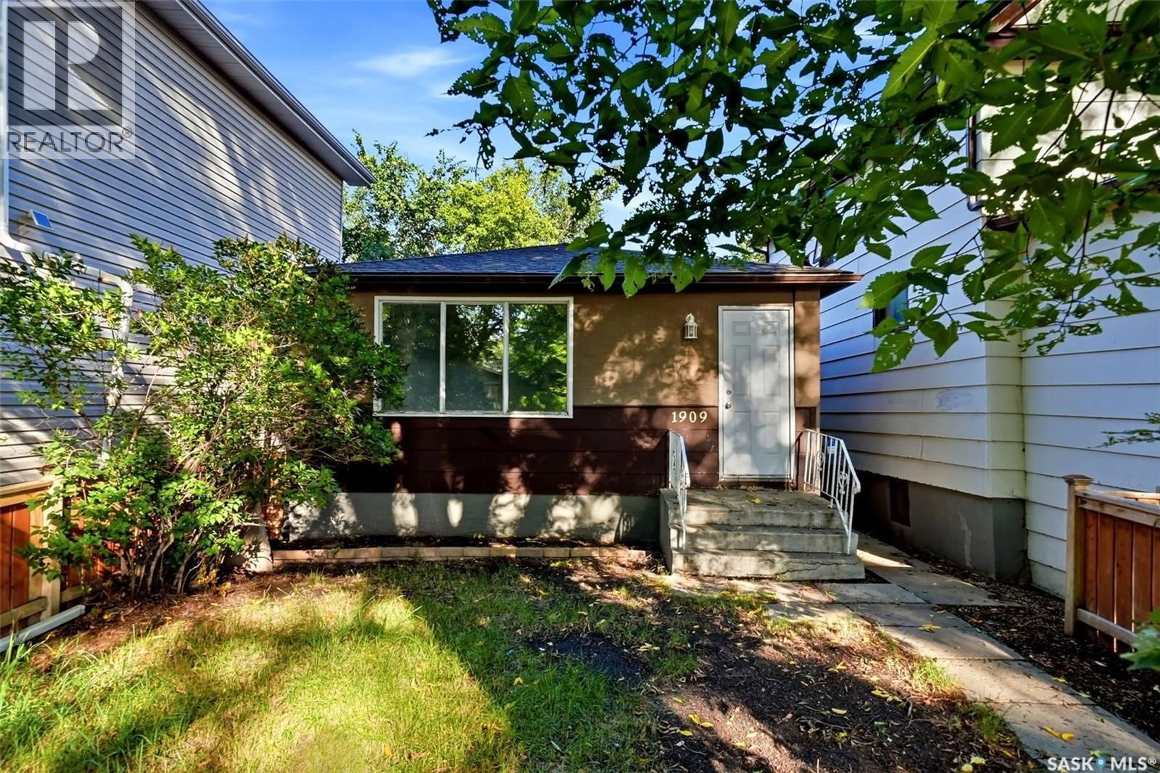 Home with vinyl exterior material, street for 1909 MONTREAL STREET, Regina Saskatchewan S4P1L4