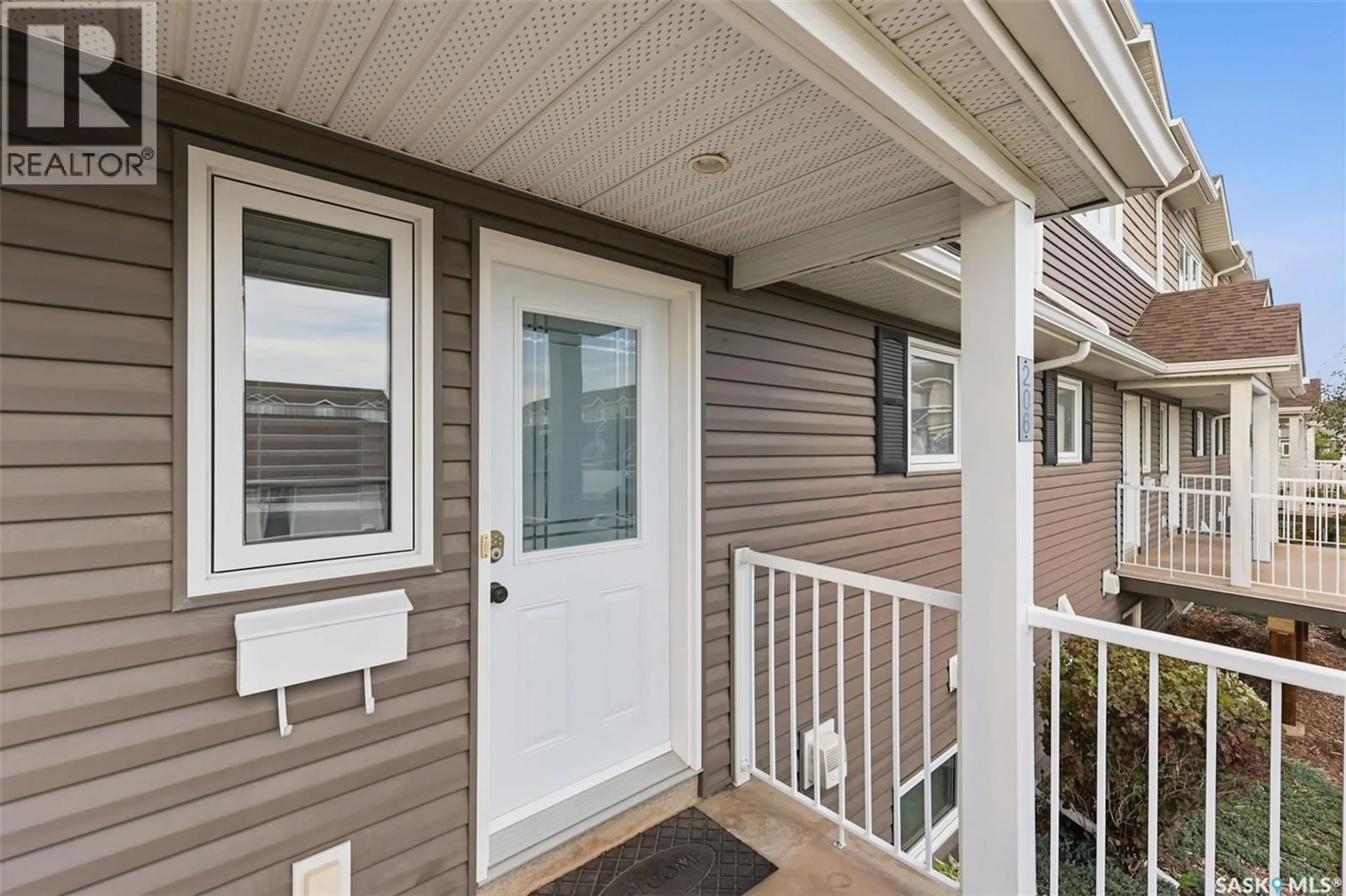 Home with vinyl exterior material, street for 206 275 PRINGLE LANE, Saskatoon Saskatchewan S7T0T5