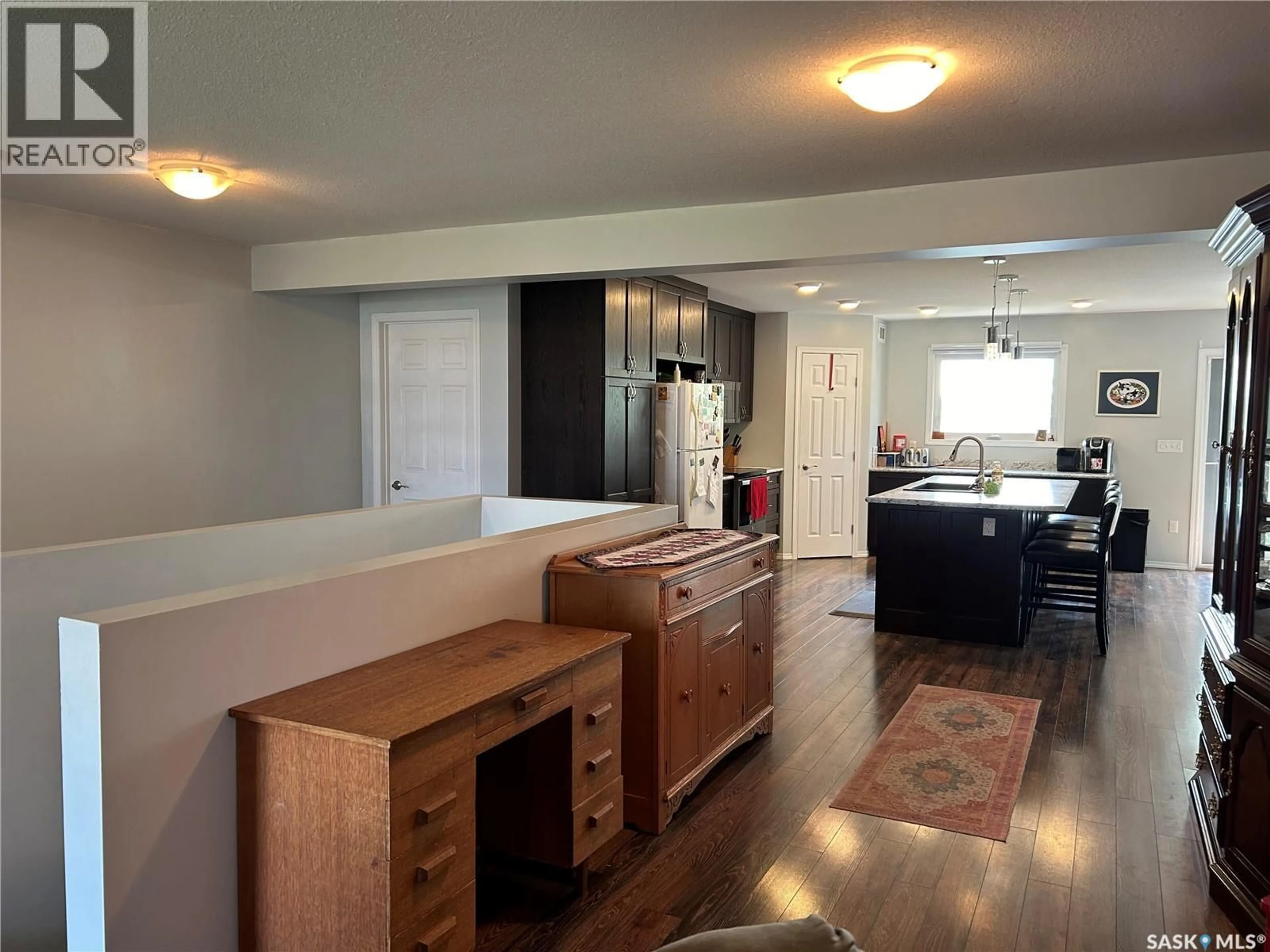 Open concept kitchen, wood/laminate floor for 615 1ST AVENUE, Bruno Saskatchewan S0K0S0