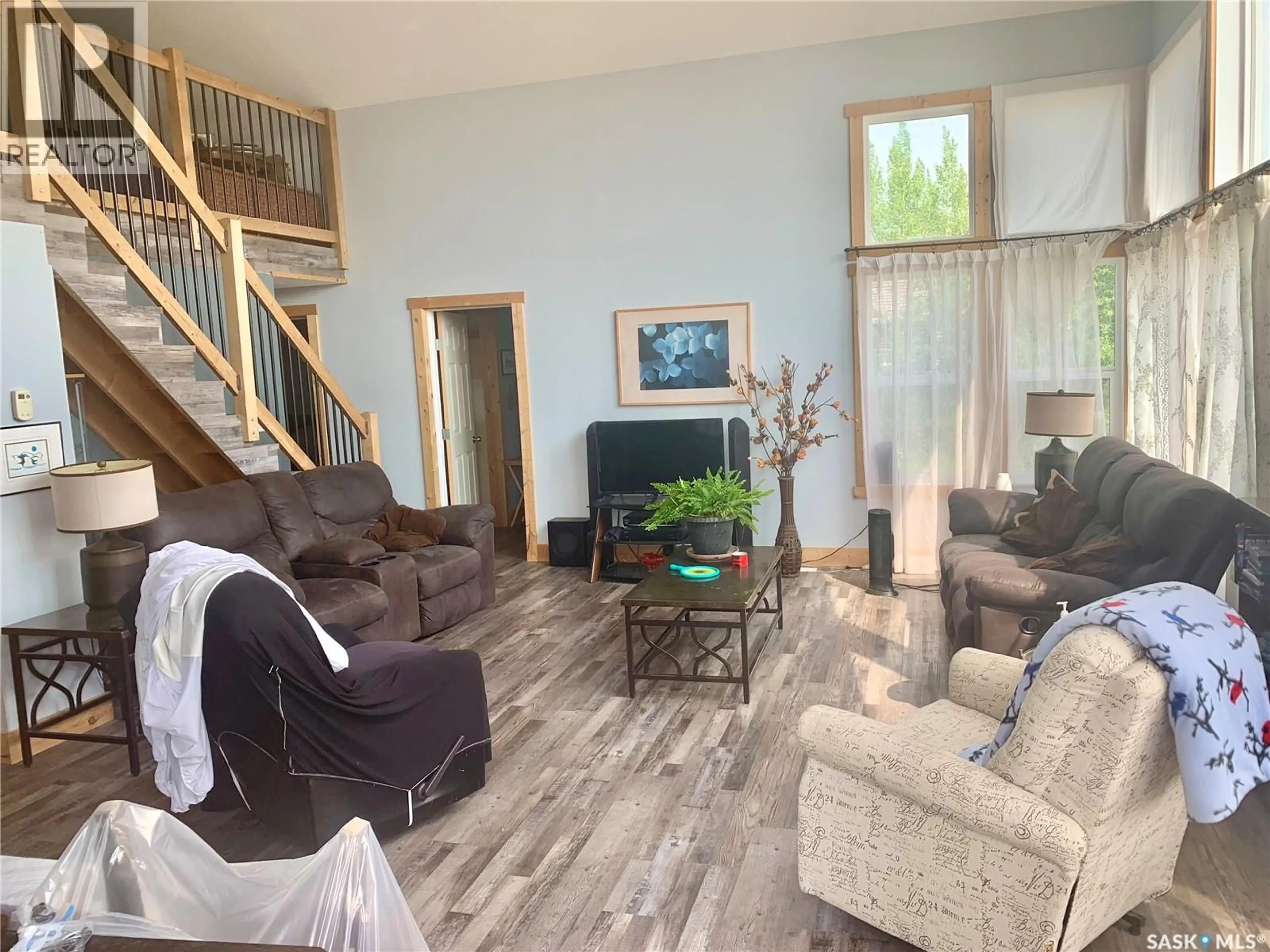 Living room with furniture, wood/laminate floor for 49 LAKESHORE DRIVE, Invergordon Rm No. 430 Saskatchewan S0K1A0