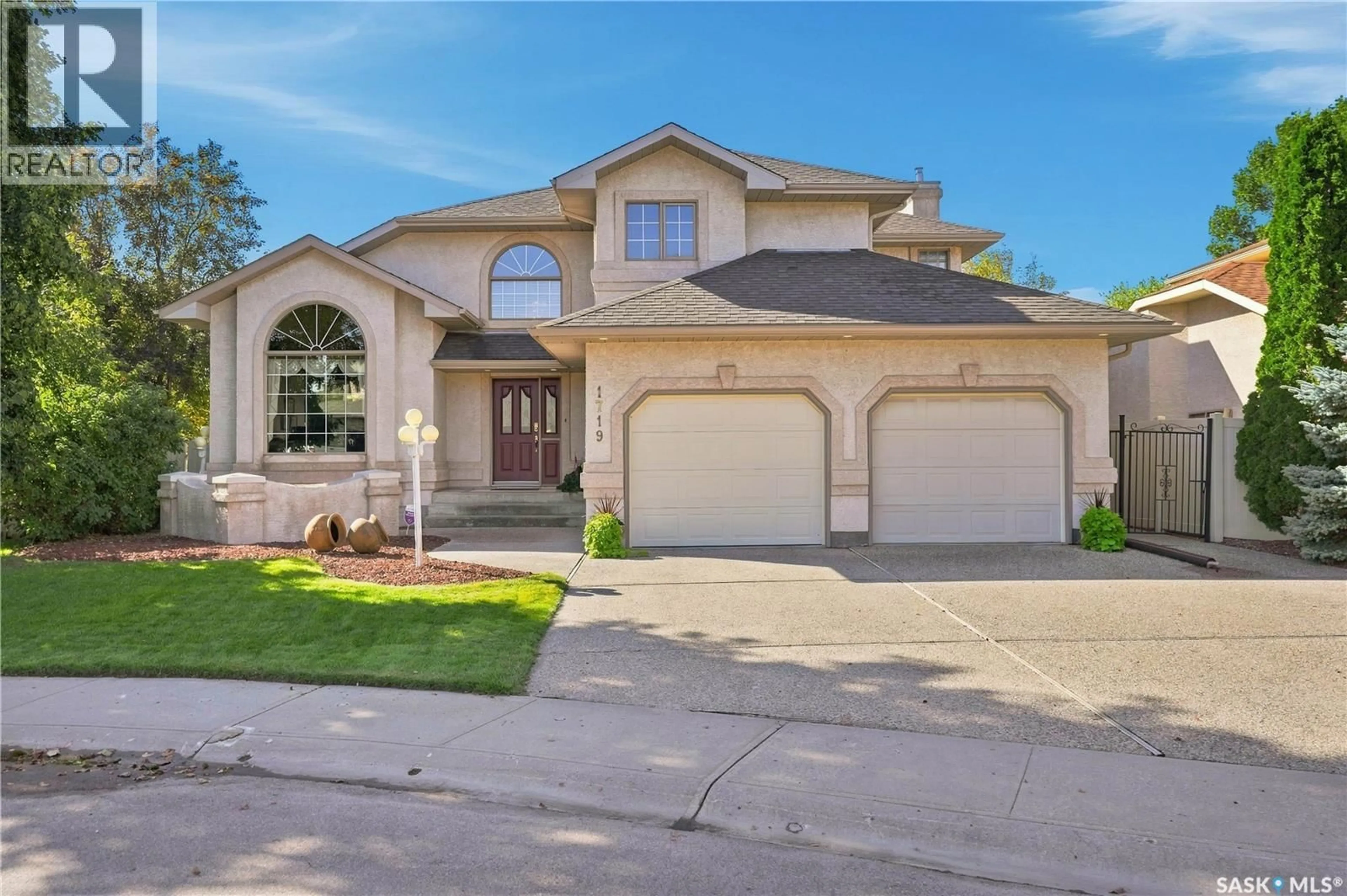 Home with brick exterior material, street for 1719 CLIVE BAY E, Regina Saskatchewan S4V2R8