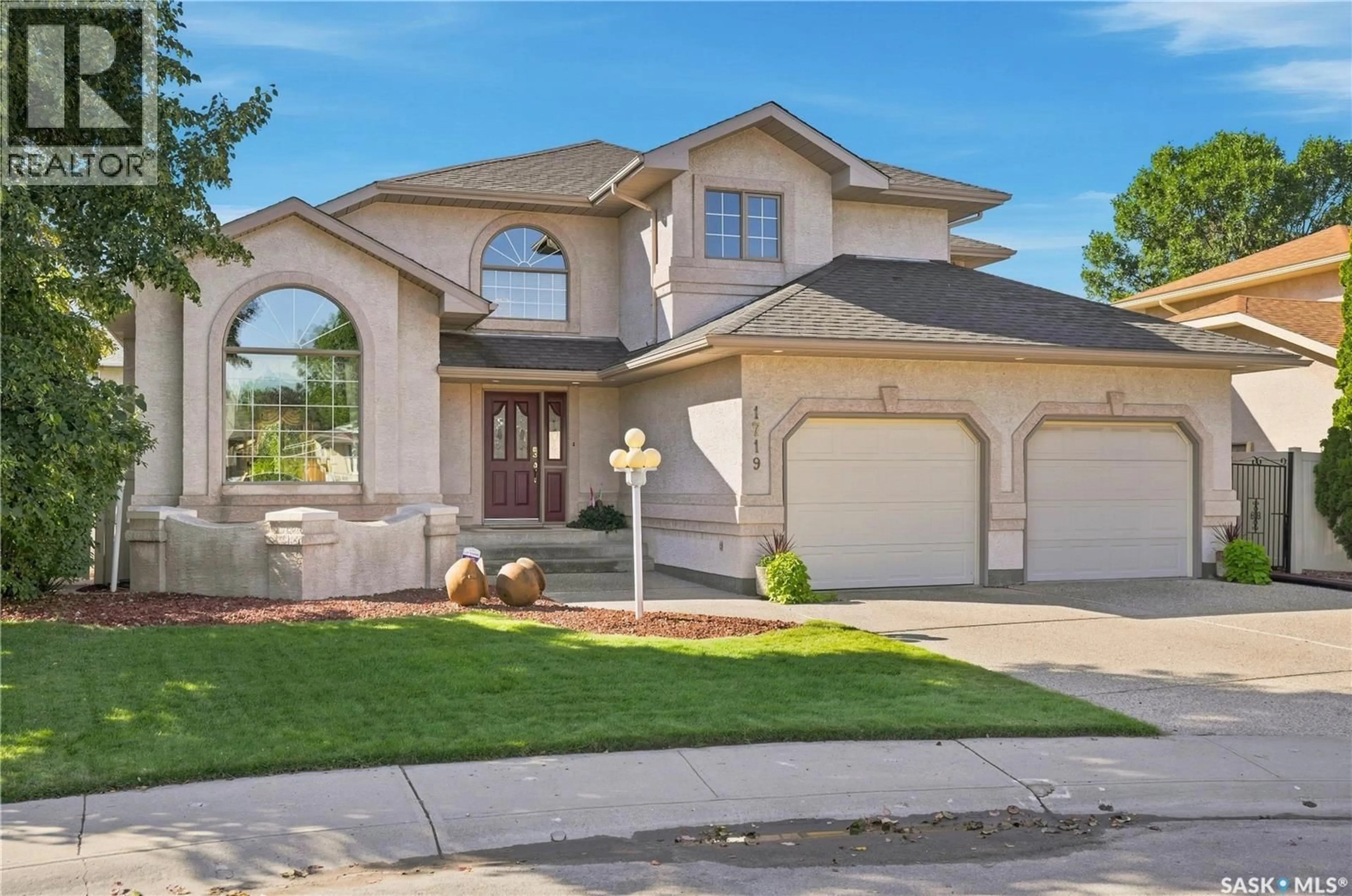 Home with brick exterior material, street for 1719 CLIVE BAY E, Regina Saskatchewan S4V2R8