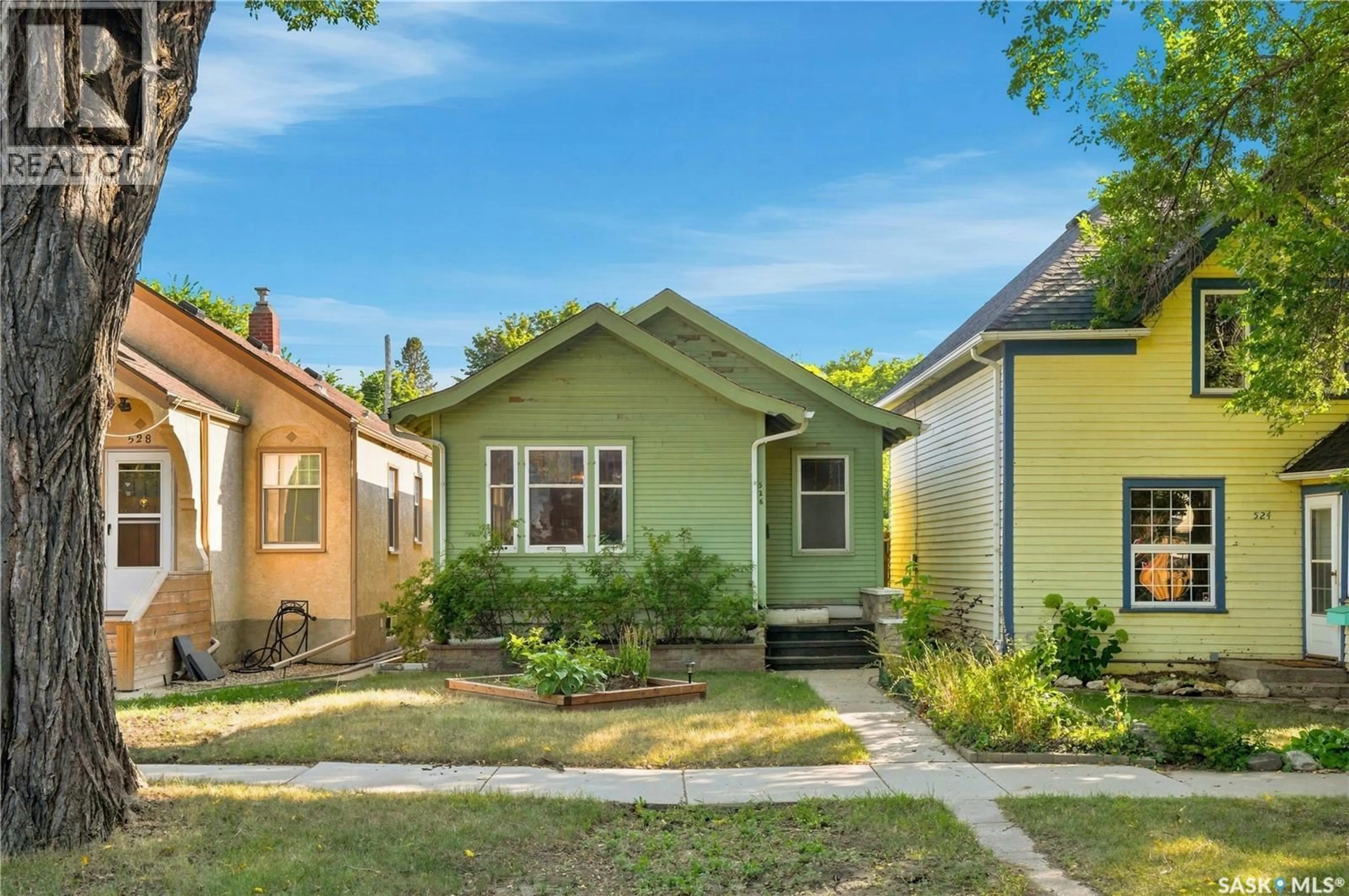 Home with vinyl exterior material, street for 526 7TH STREET, Saskatoon Saskatchewan S7H0X7