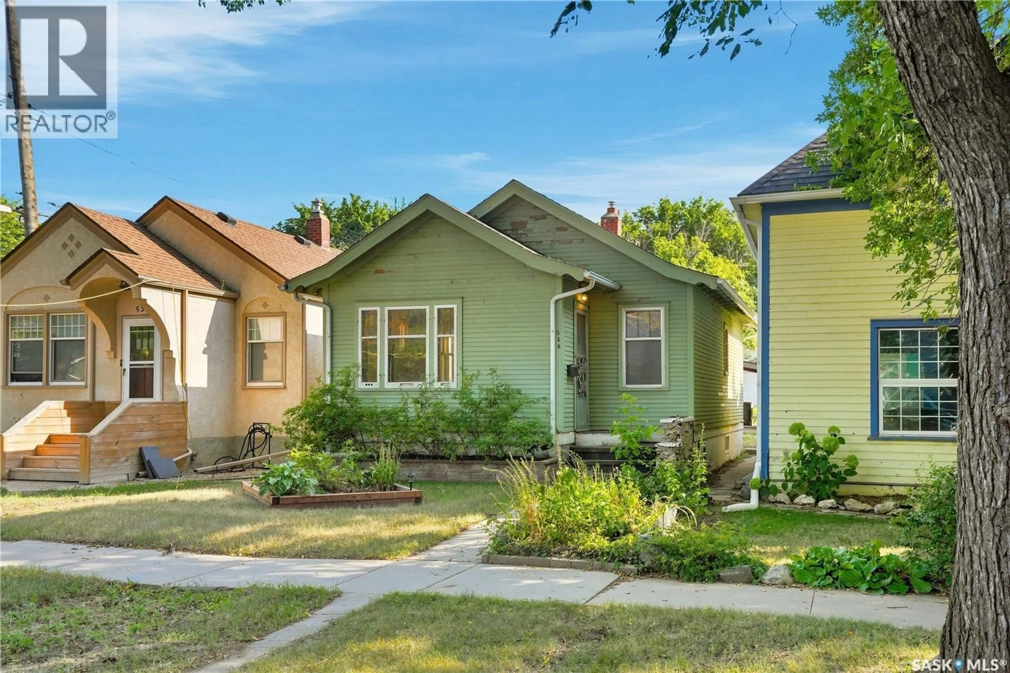 Home with vinyl exterior material, street for 526 7TH STREET, Saskatoon Saskatchewan S7H0X7