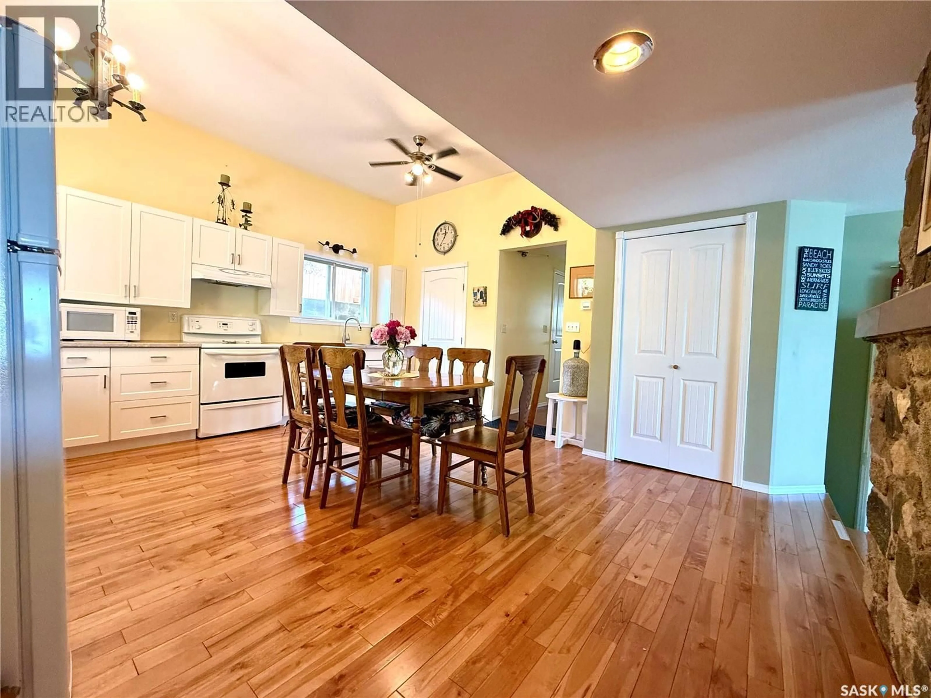 Open concept kitchen, wood/laminate floor for 144 LAKEVIEW DRIVE, Crystal Lake Saskatchewan S0A0L0