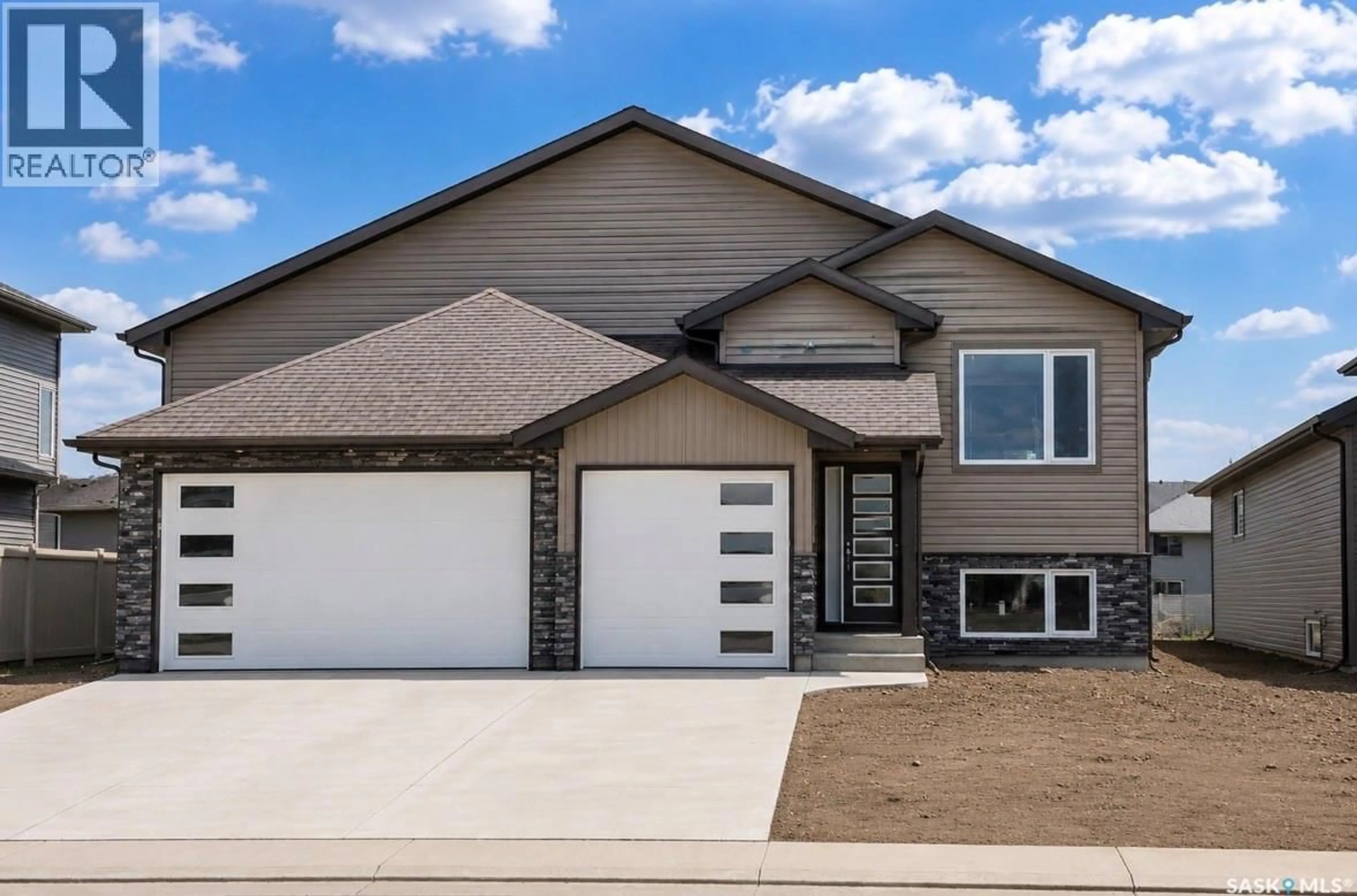 Home with vinyl exterior material, street for 216 VETERANS DRIVE, Warman Saskatchewan S0K4S4