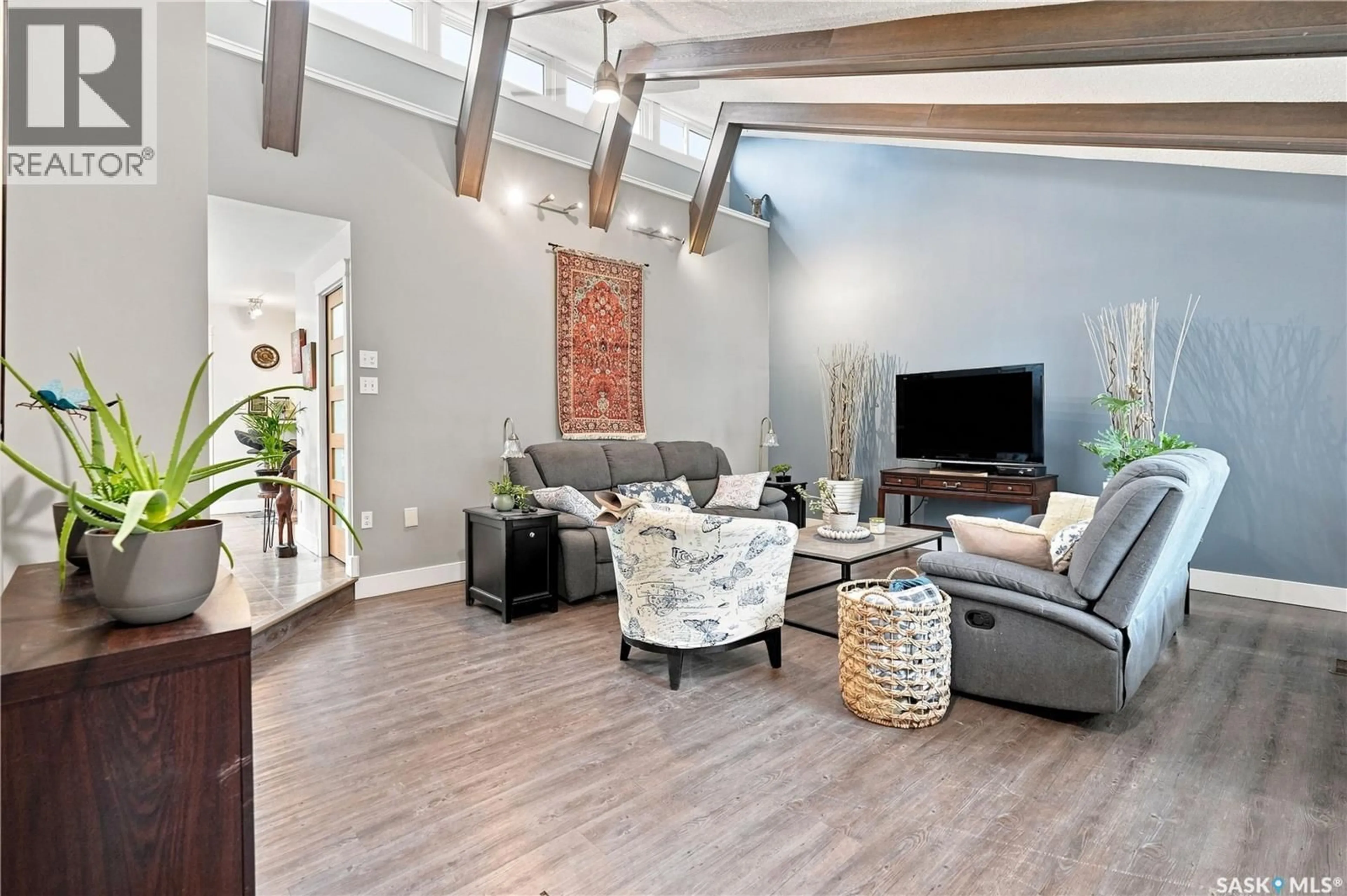 Living room with furniture, wood/laminate floor for RM Edenwold No - 158 FABIAN ACERAGE, Edenwold Rm No.158 Saskatchewan S0G3Z0