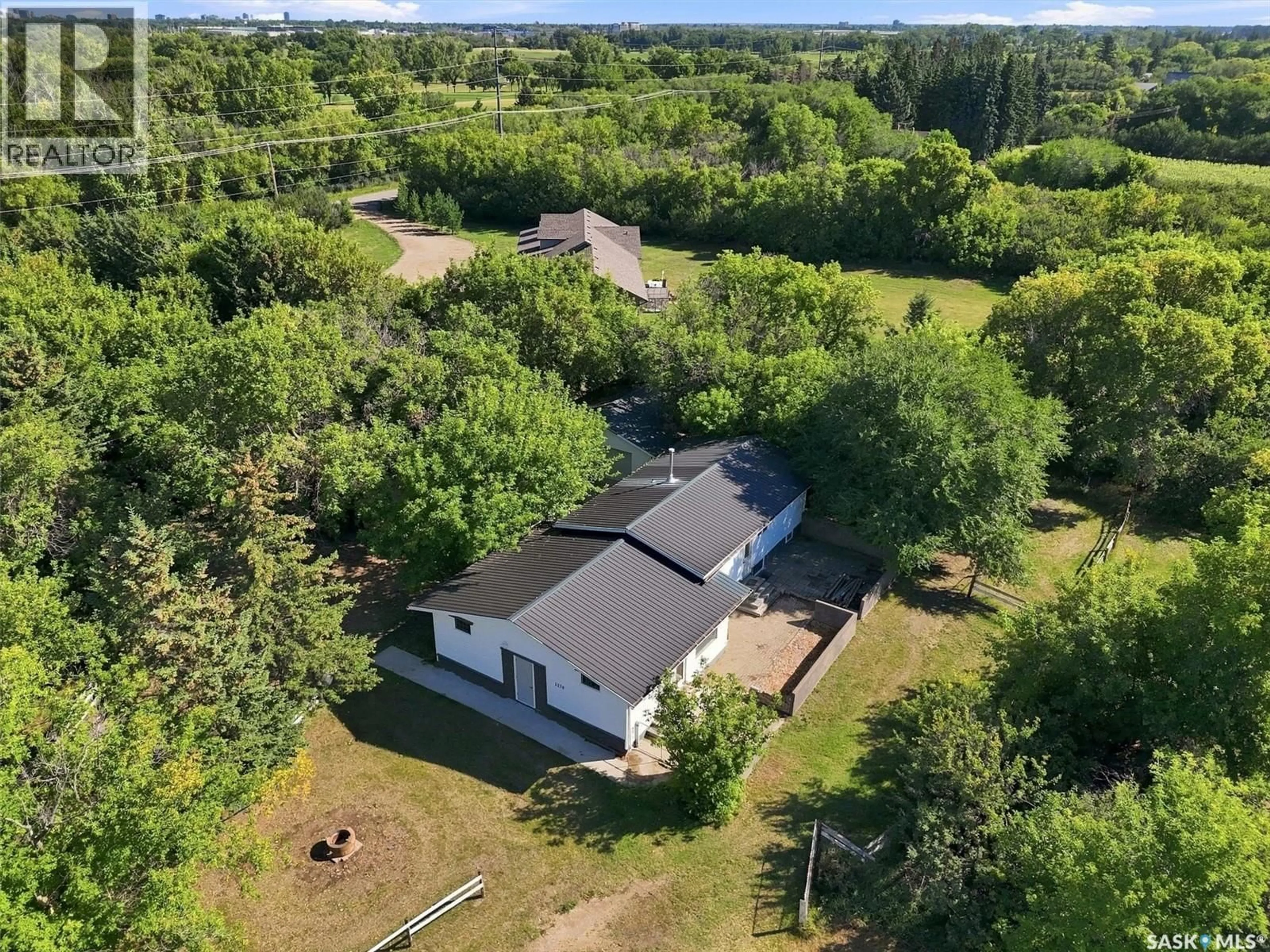 A pic from outside/outdoor area/front of a property/back of a property/a pic from drone, unknown for 1570 CARTWRIGHT STREET, Corman Park Rm No. 344 Saskatchewan S7T1B1