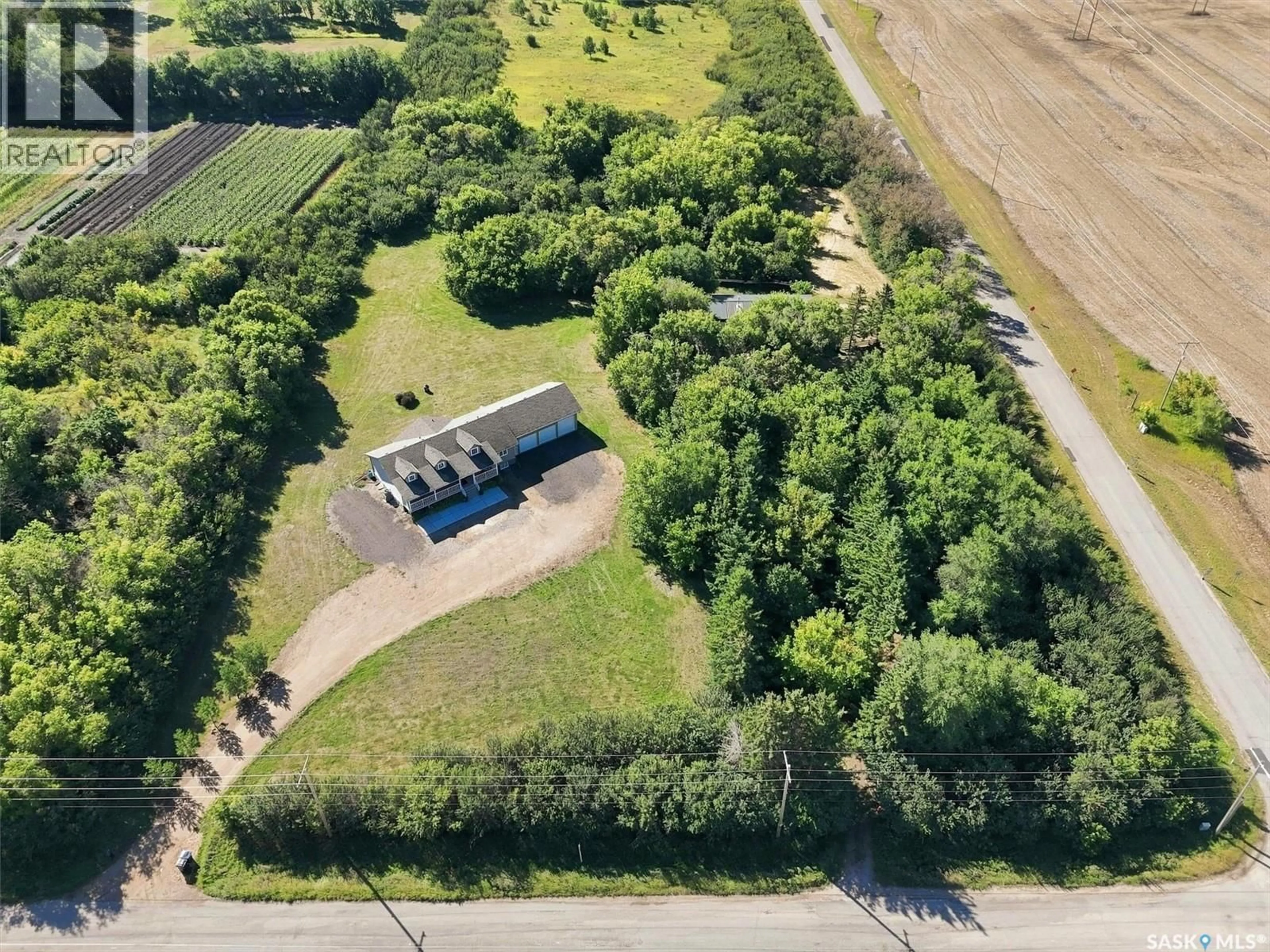 A pic from outside/outdoor area/front of a property/back of a property/a pic from drone, street for 1570 CARTWRIGHT STREET, Corman Park Rm No. 344 Saskatchewan S7T1B1