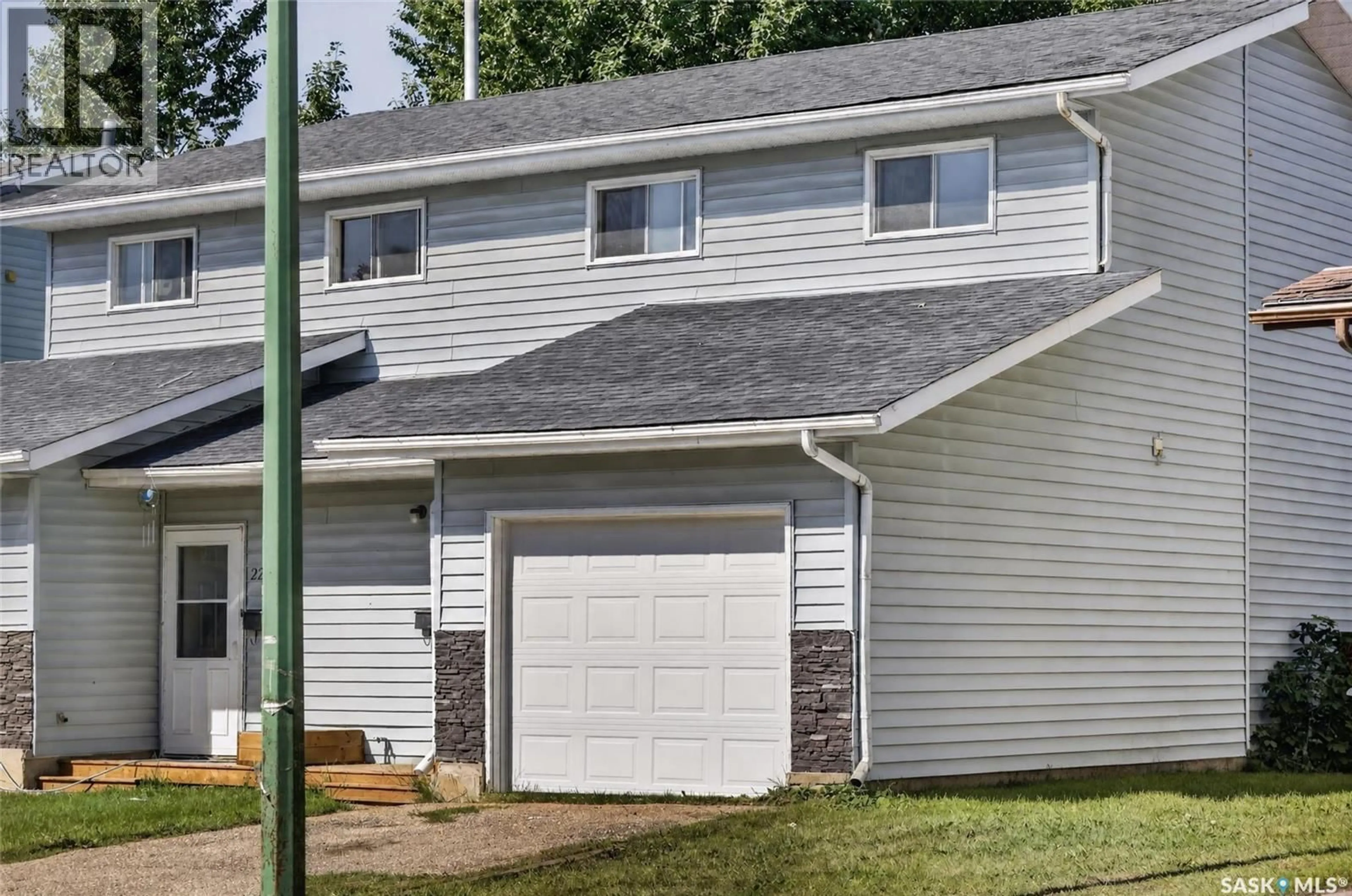 Home with vinyl exterior material, street for 223-225 WAKABAYASHI WAY, Saskatoon Saskatchewan S7K7M4
