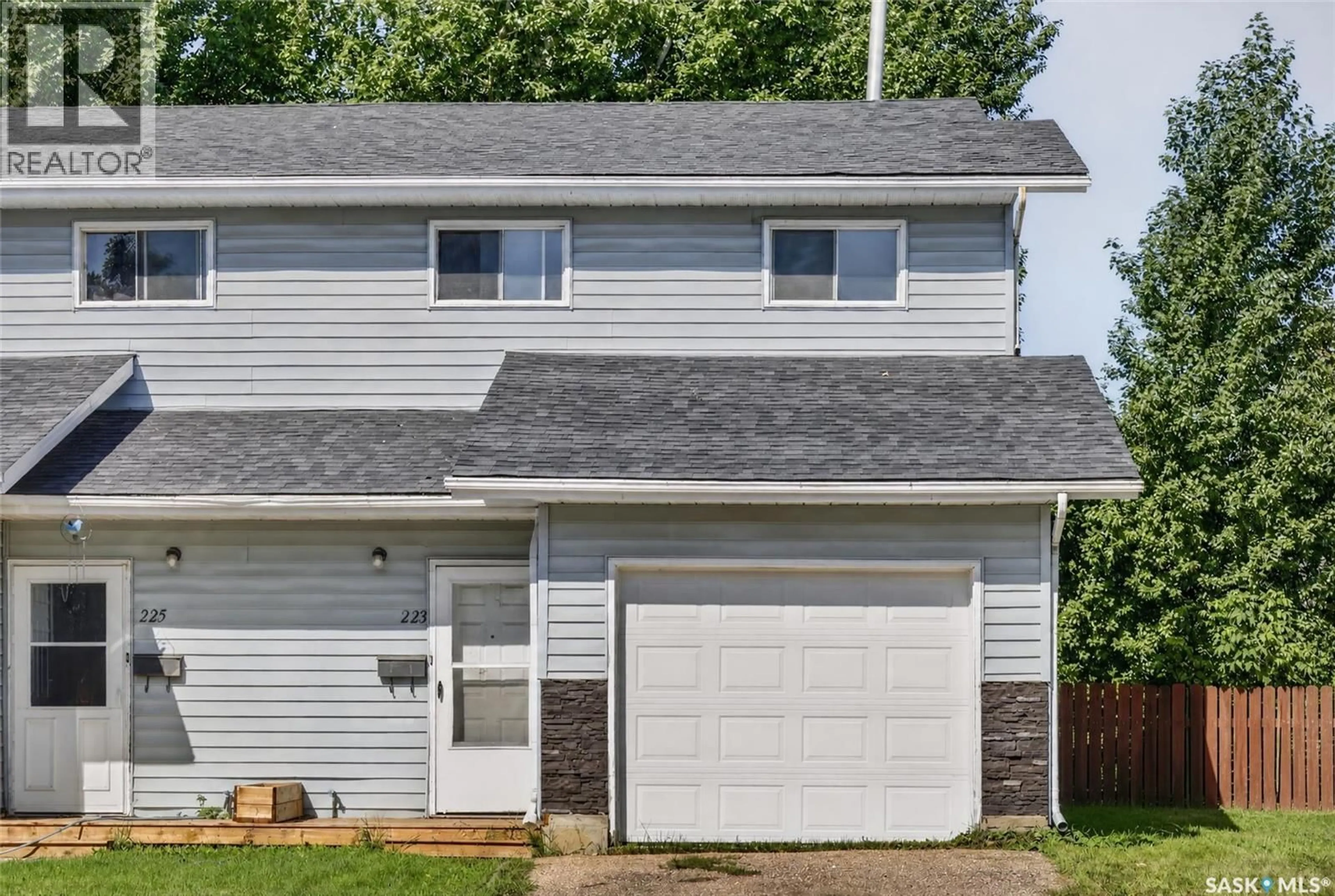 Home with vinyl exterior material, street for 223-225 WAKABAYASHI WAY, Saskatoon Saskatchewan S7K7M4
