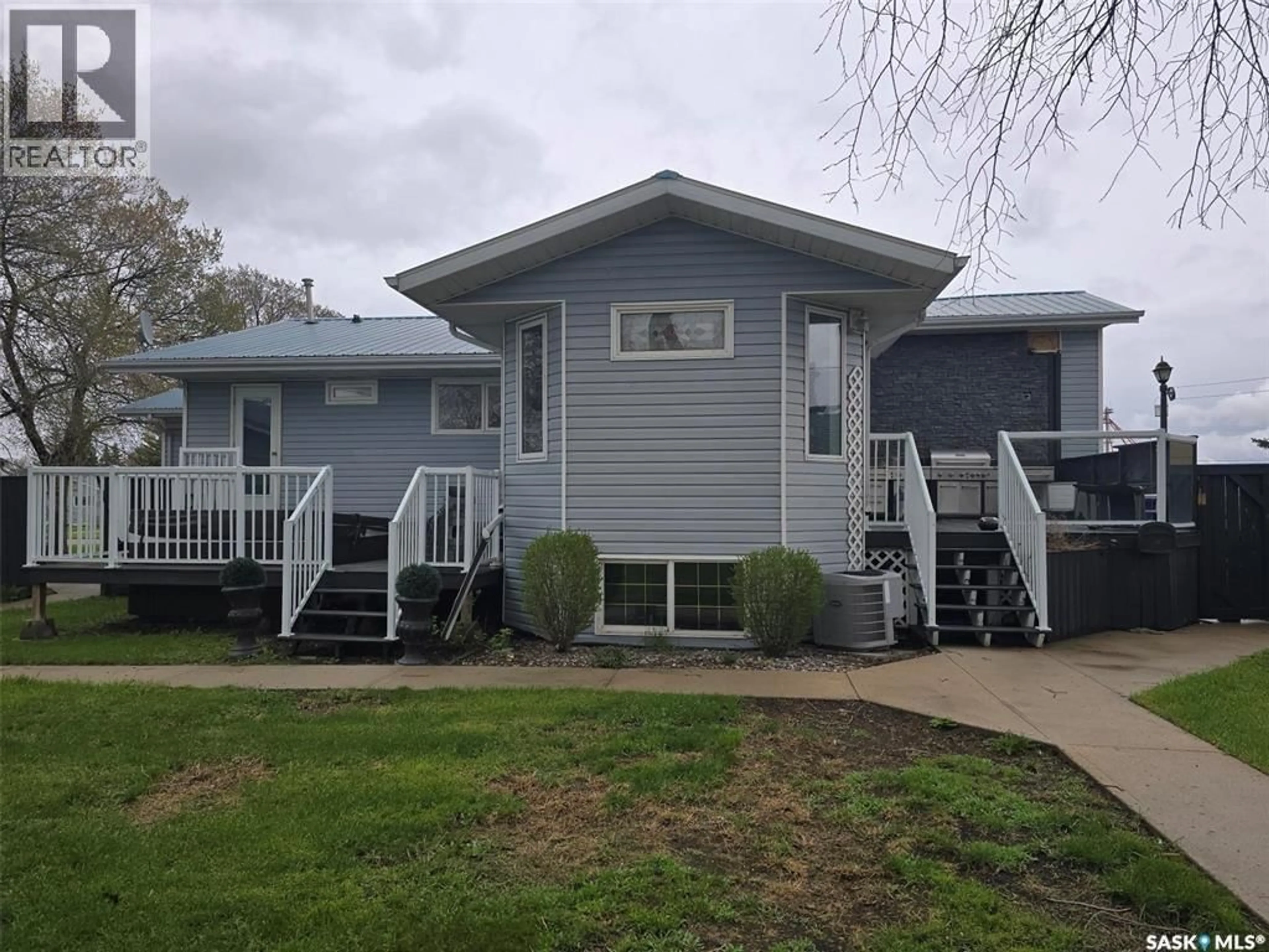 Home with vinyl exterior material, street for 1010 DESMOND STREET, Grenfell Saskatchewan S0G2B0