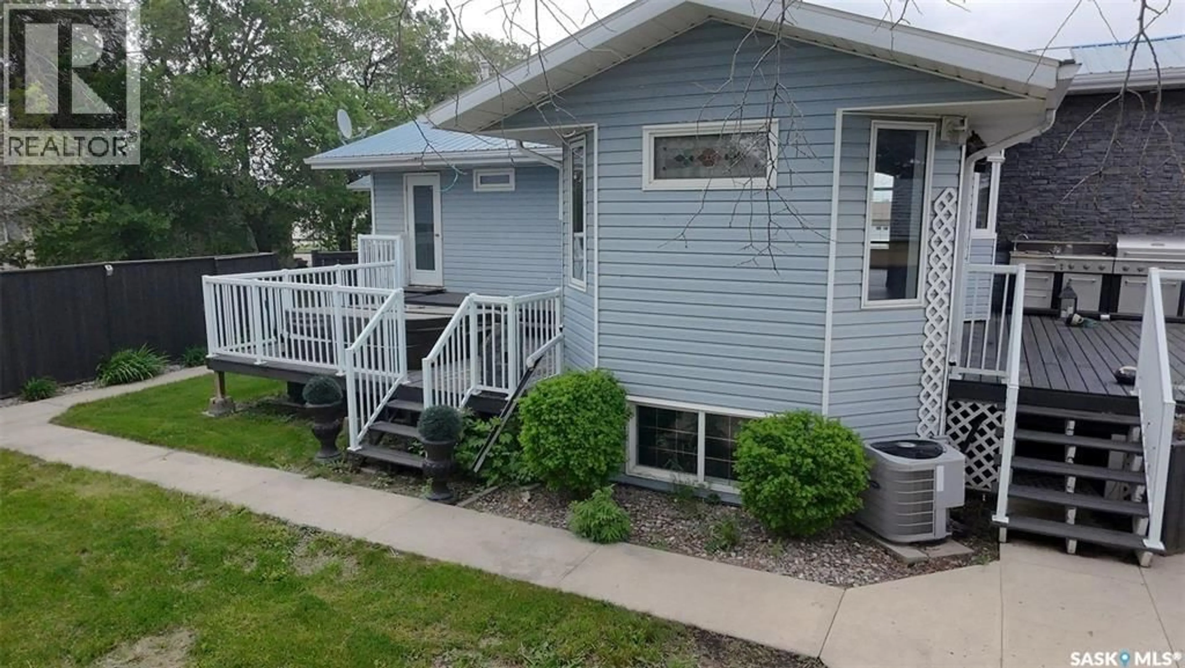 Home with vinyl exterior material, street for 1010 DESMOND STREET, Grenfell Saskatchewan S0G2B0