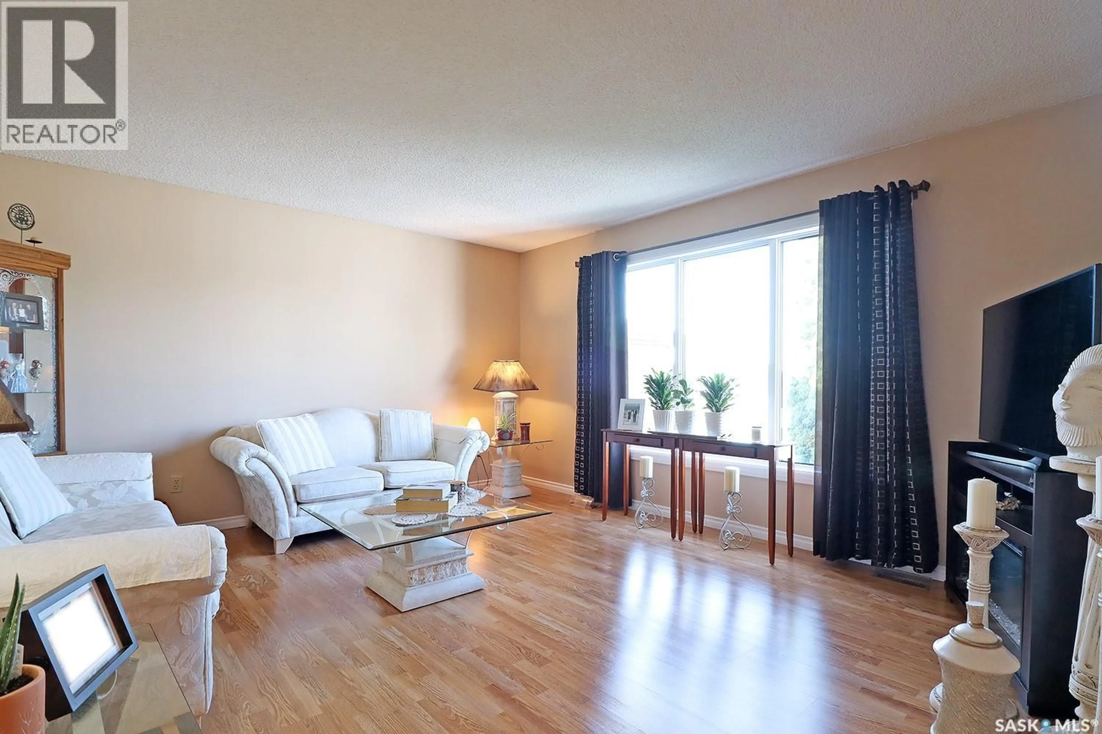 Living room with furniture, wood/laminate floor for 368 DARLINGTON STREET, Yorkton Saskatchewan S3N3V7