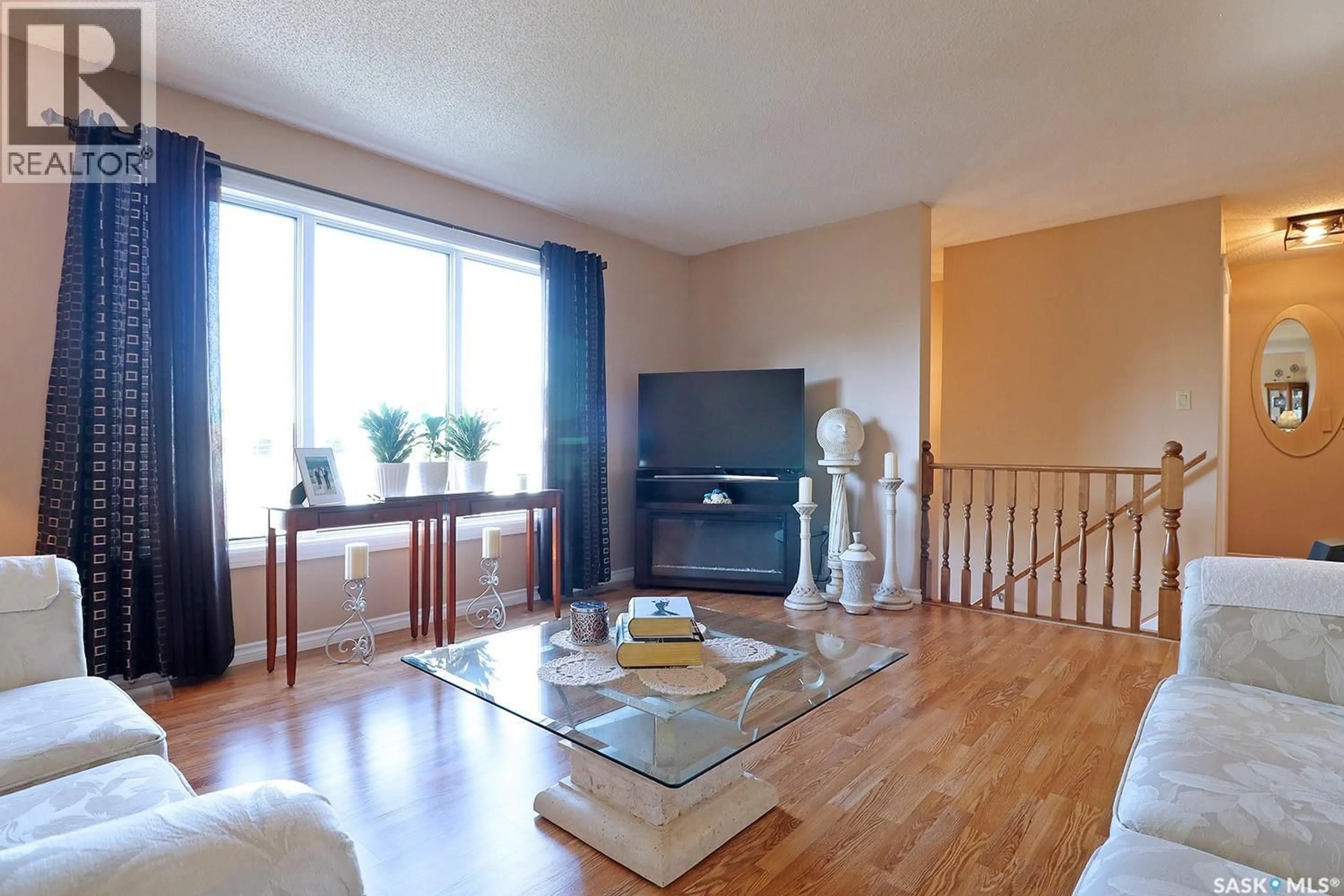 Living room with furniture, wood/laminate floor for 368 DARLINGTON STREET, Yorkton Saskatchewan S3N3V7