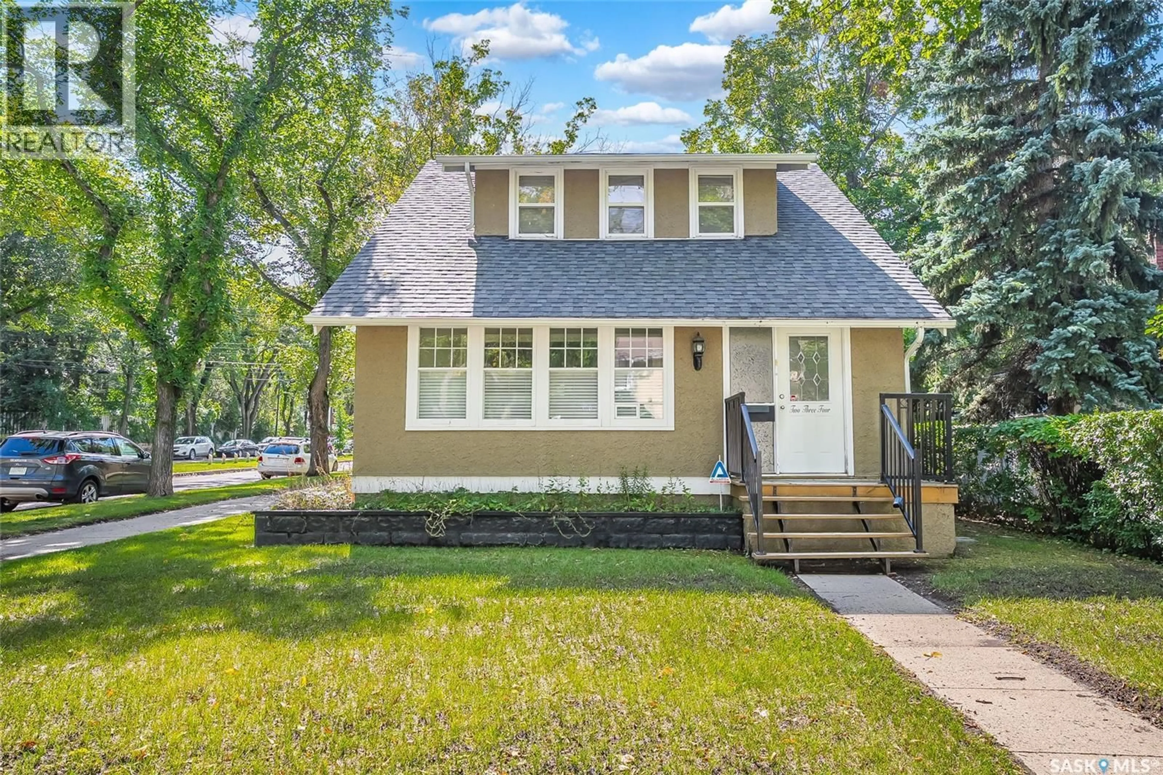 Home with vinyl exterior material, street for 234 10TH STREET, Saskatoon Saskatchewan S7N0C5