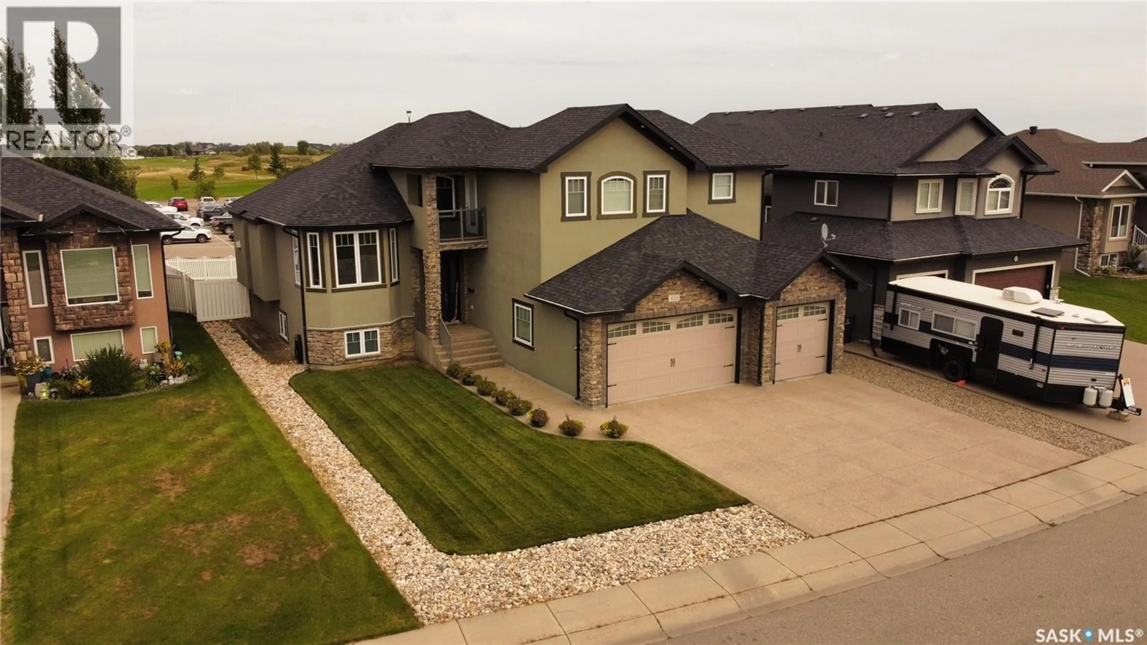 A pic from outside/outdoor area/front of a property/back of a property/a pic from drone, street for 410 NICKLAUS DRIVE, Warman Saskatchewan S0K4S1
