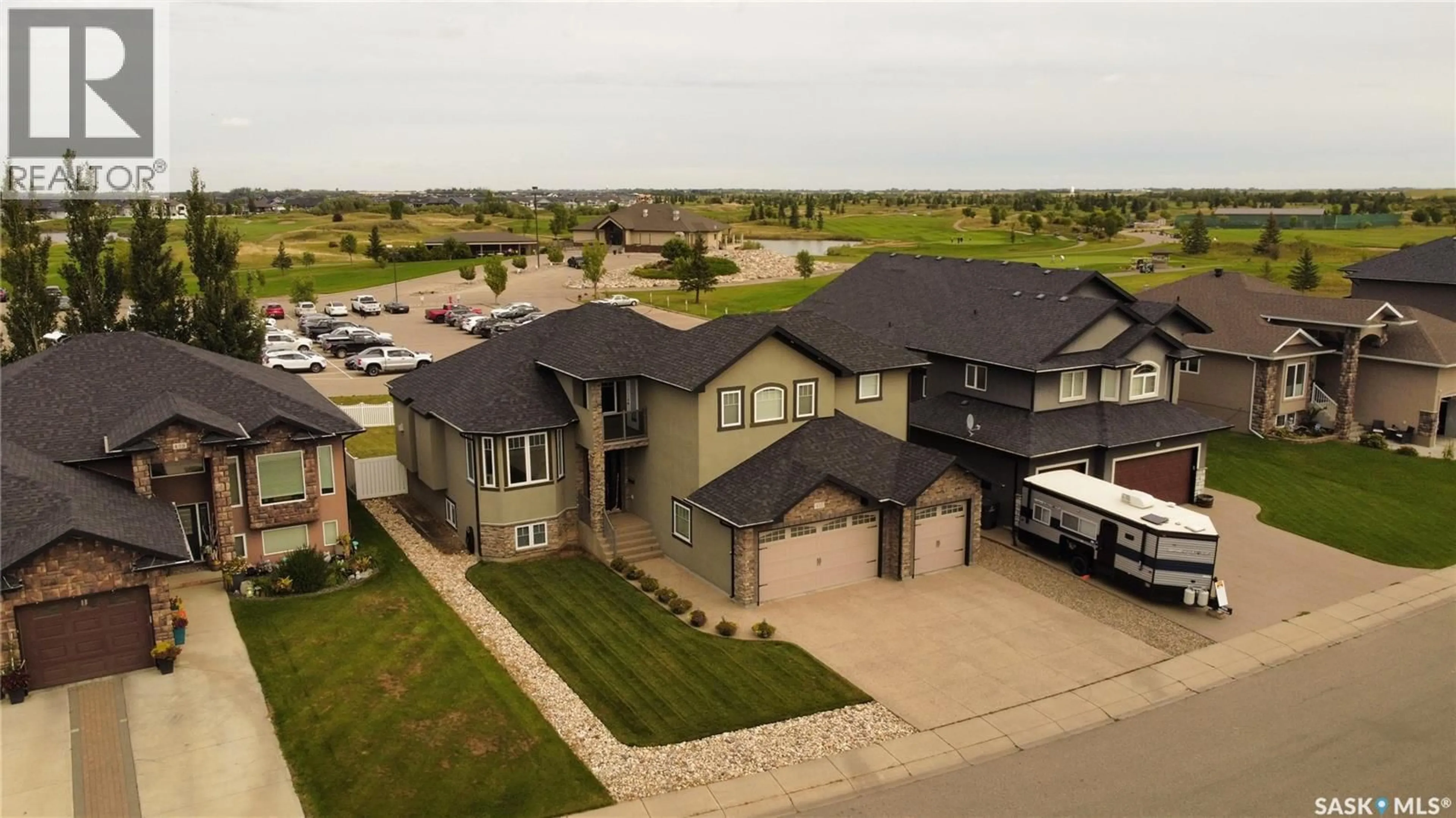 A pic from outside/outdoor area/front of a property/back of a property/a pic from drone, street for 410 NICKLAUS DRIVE, Warman Saskatchewan S0K4S1