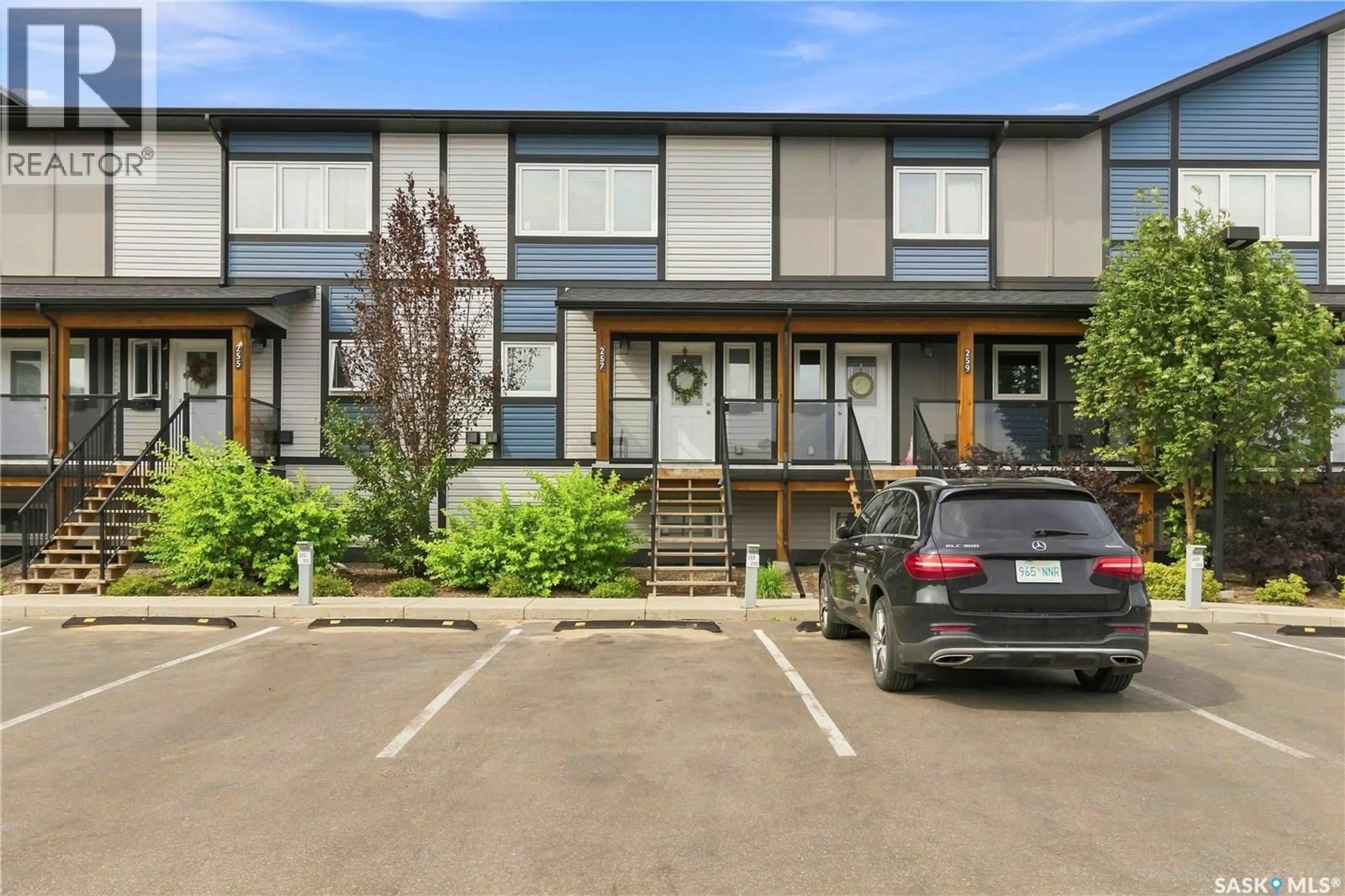 A pic from outside/outdoor area/front of a property/back of a property/a pic from drone, street for 250 - 257 AKHTAR BEND, Saskatoon Saskatchewan S7W0W4